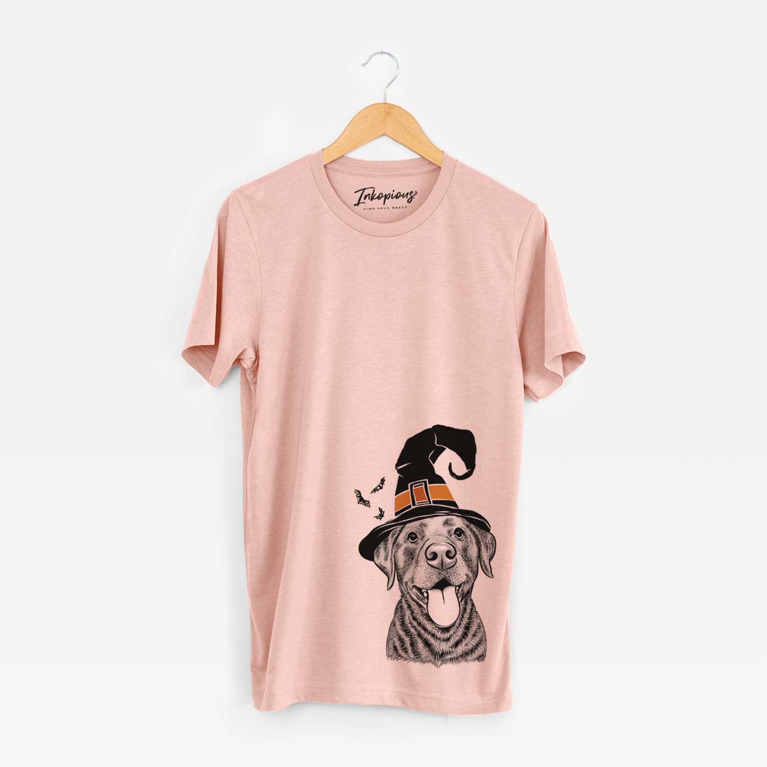 Hand-drawn sketch of Gwen the Labrador Retriever wearing a witch hat on a Peach Unisex crewneck