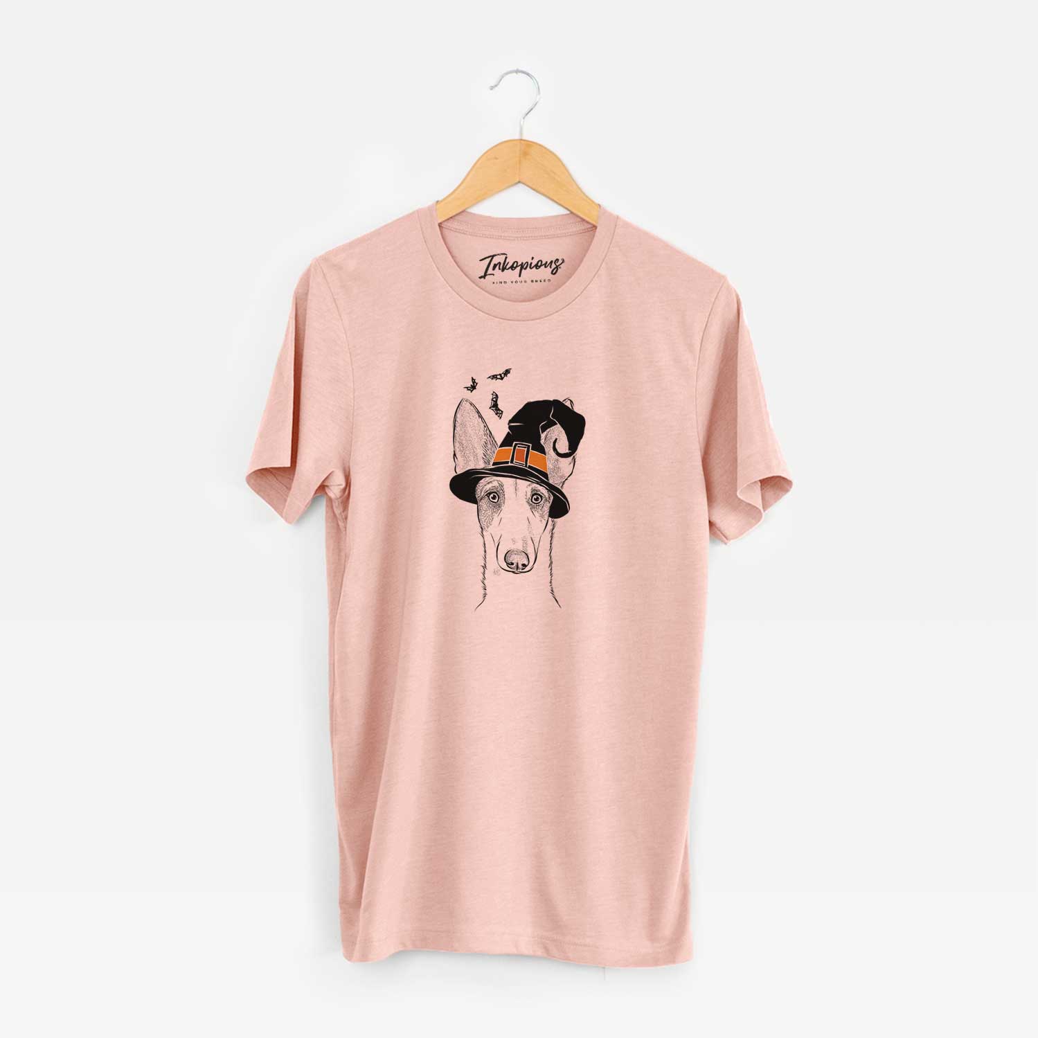 Hand-drawn sketch of Halo the Ibizan Sight Hound wearing a witch hat on a Peach Unisex crewneck