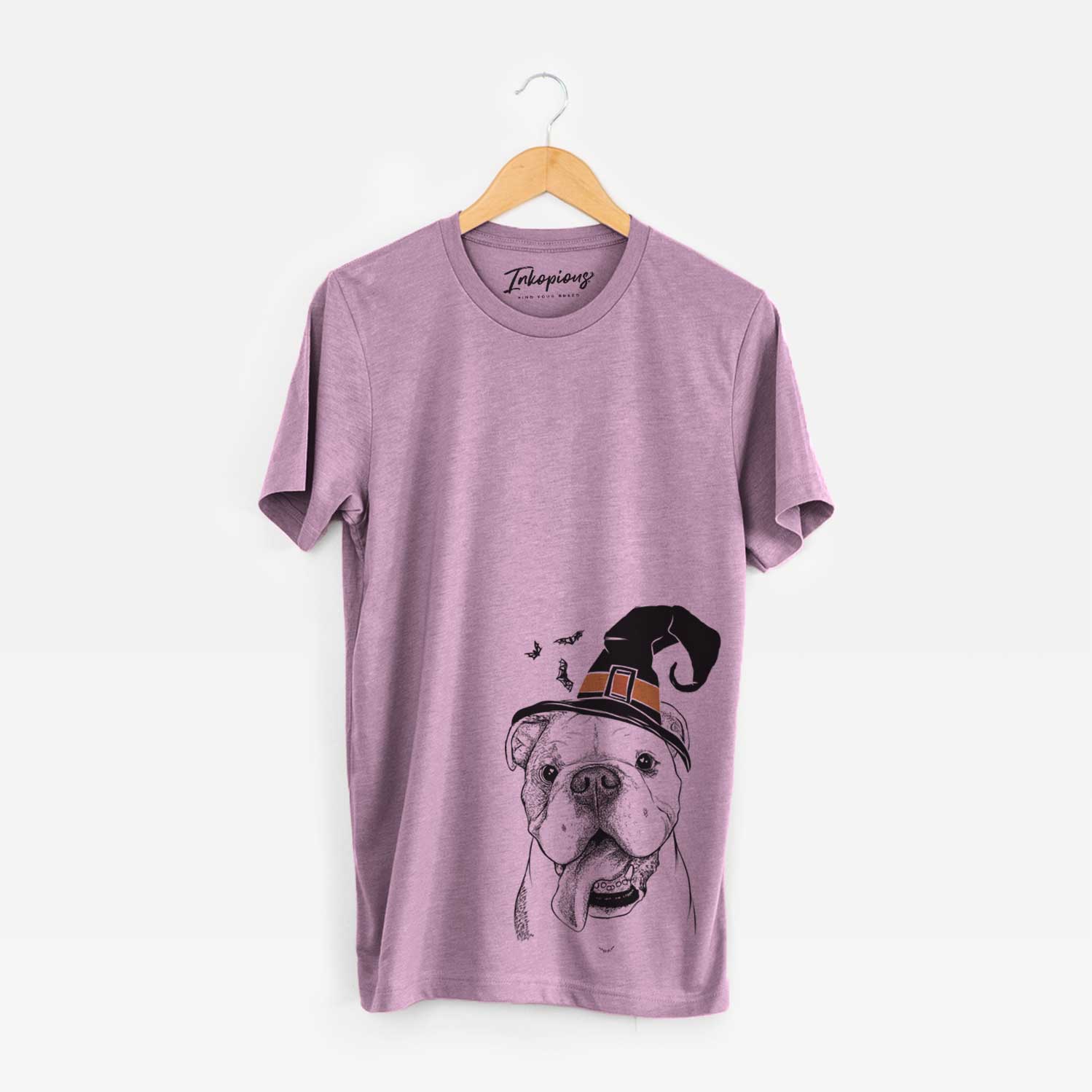 Hand-drawn sketch of Hank the English Bulldog wearing a witch hat on an Orchid Unisex crewneck