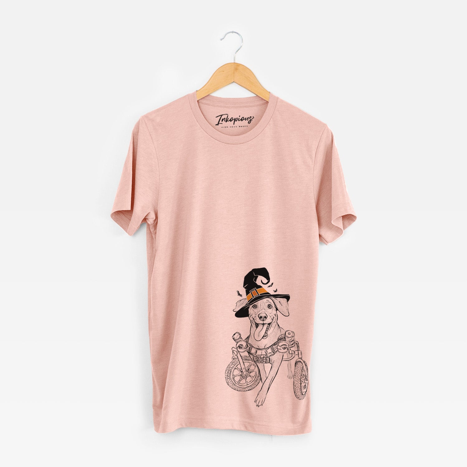Hand-drawn sketch of Hannah the Pitbull Mix wearing a witch hat on a Peach Unisex crewneck