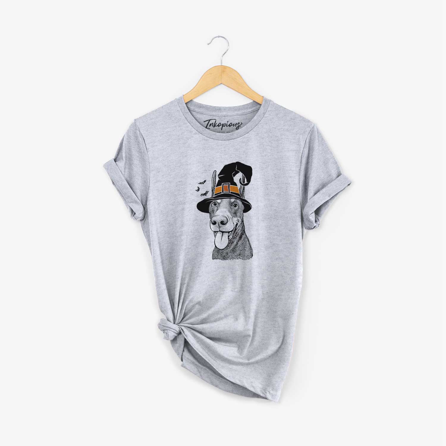 Hand-drawn sketch of Happy Sunny the Doberman Pinscher wearing a witch hat on a Grey Unisex crewneck