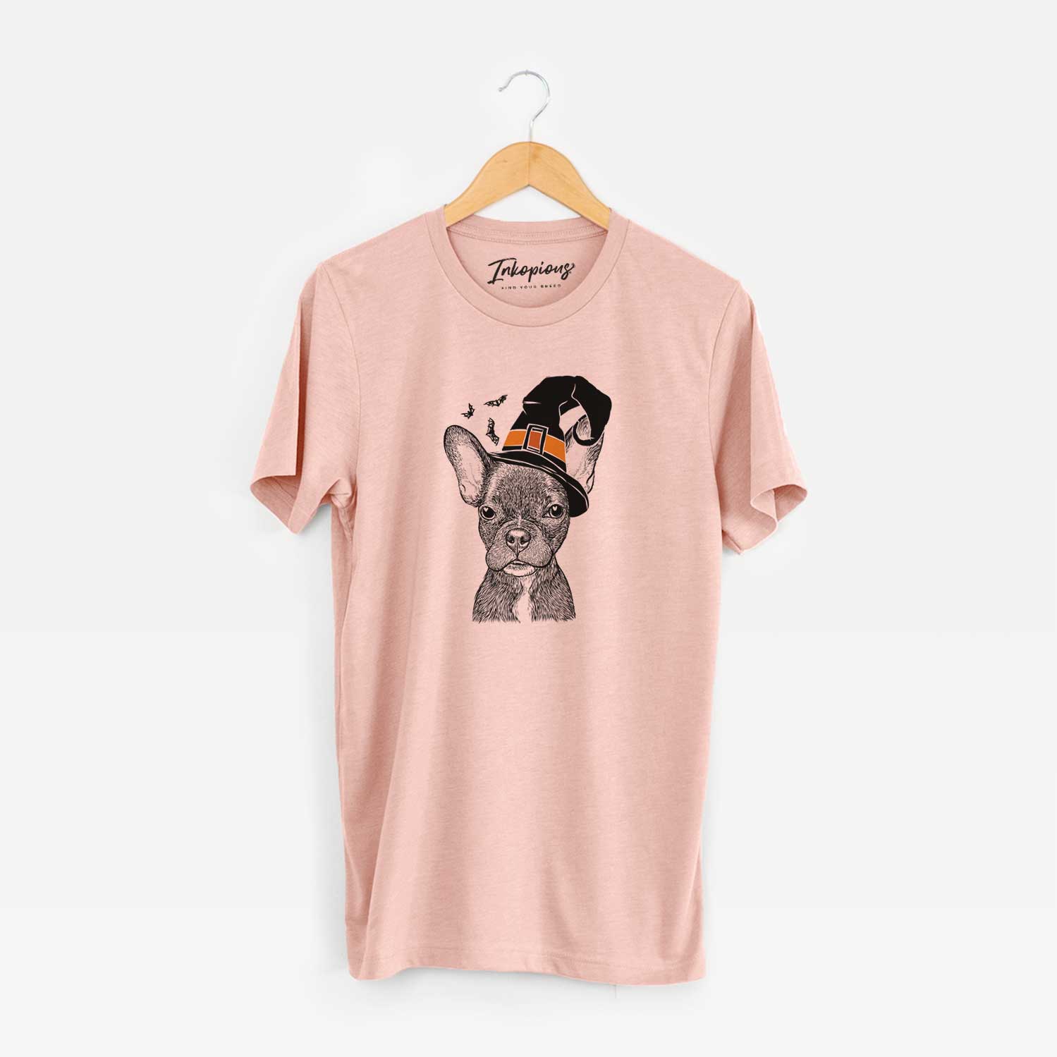 Hand-drawn sketch of Henry the French Bulldog wearing a witch hat on a Peach Unisex crewneck