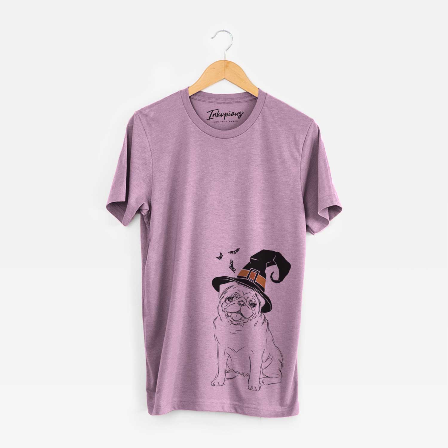 Hand-drawn sketch of Higgins the Pug wearing a witch hat on an Orchid Unisex crewneck