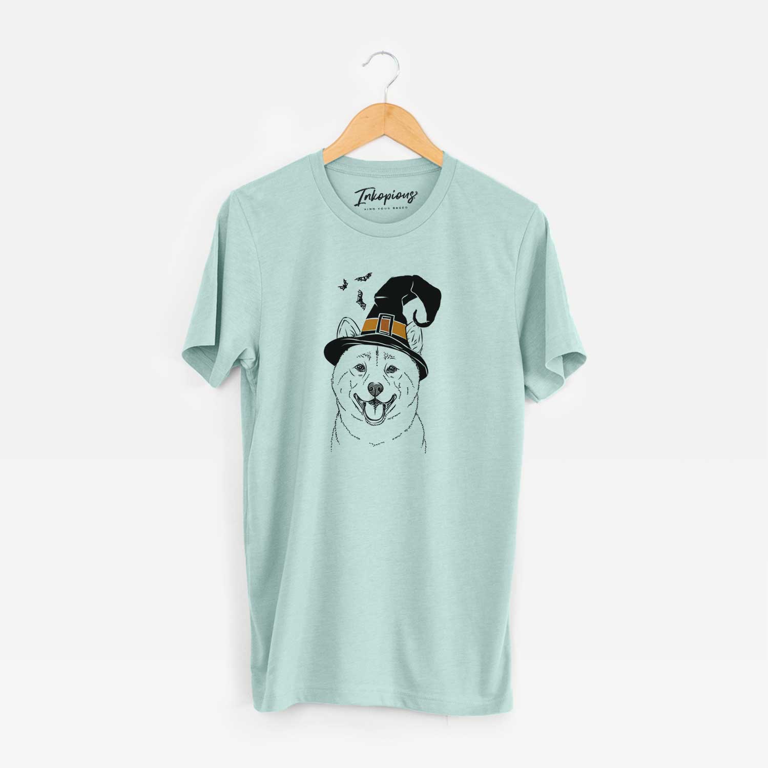 Hand-drawn sketch of Hiro the Shiba Inu wearing a witch hat on a Heather Sage Unisex crewneck