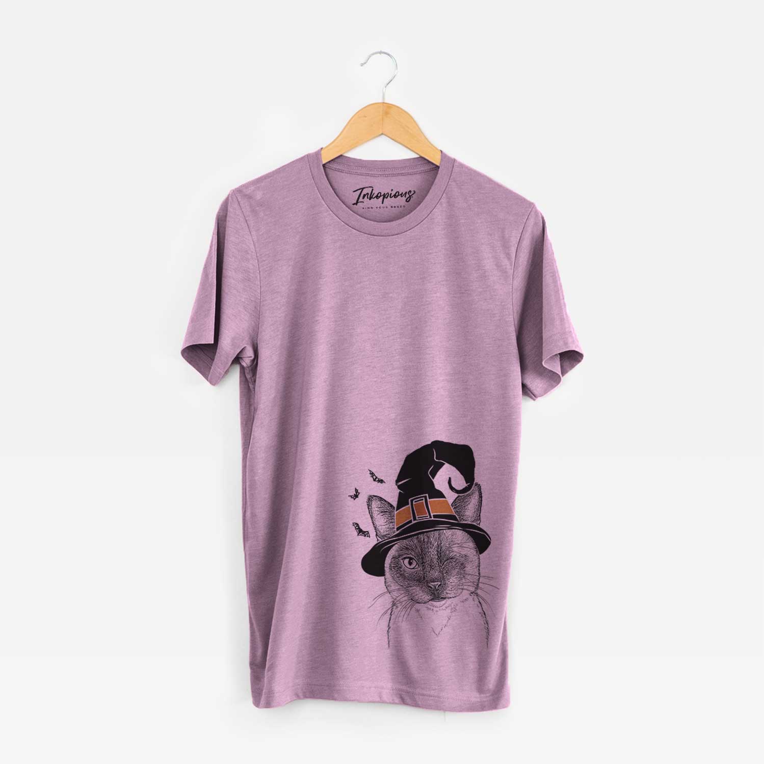 Hand-drawn sketch of Hoggle the Siamese Cat wearing a witch hat on an Orchid Unisex crewneck