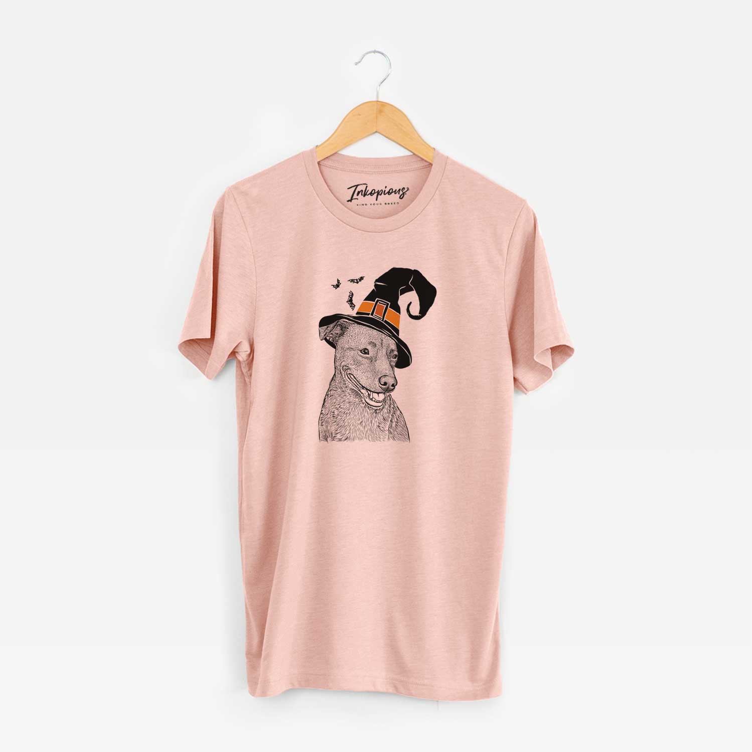 Hand-drawn sketch of Honey the Lab Pit Mix wearing a witch hat on a Peach Unisex crewneck