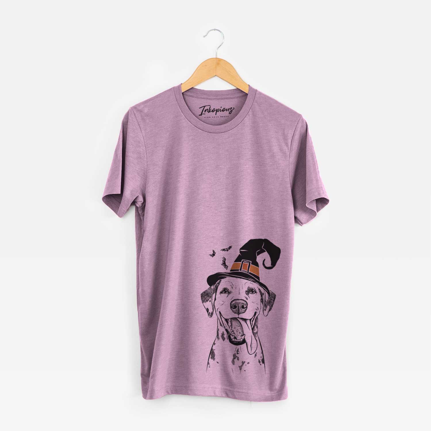 Hand-drawn sketch of Hydro the Dalmatian wearing a witch hat on an Orchid Unisex crewneck