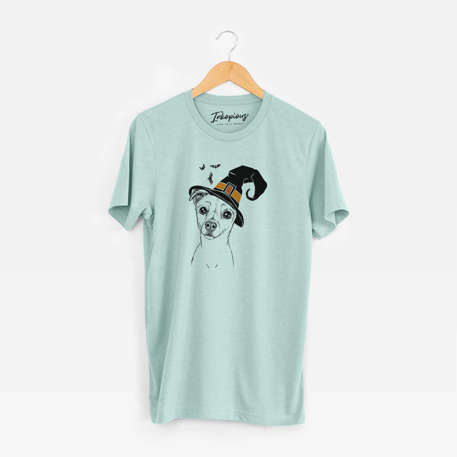 Hand-drawn sketch of Izzy the Chiweenie wearing a witch hat on a Heather Sage Unisex crewneck