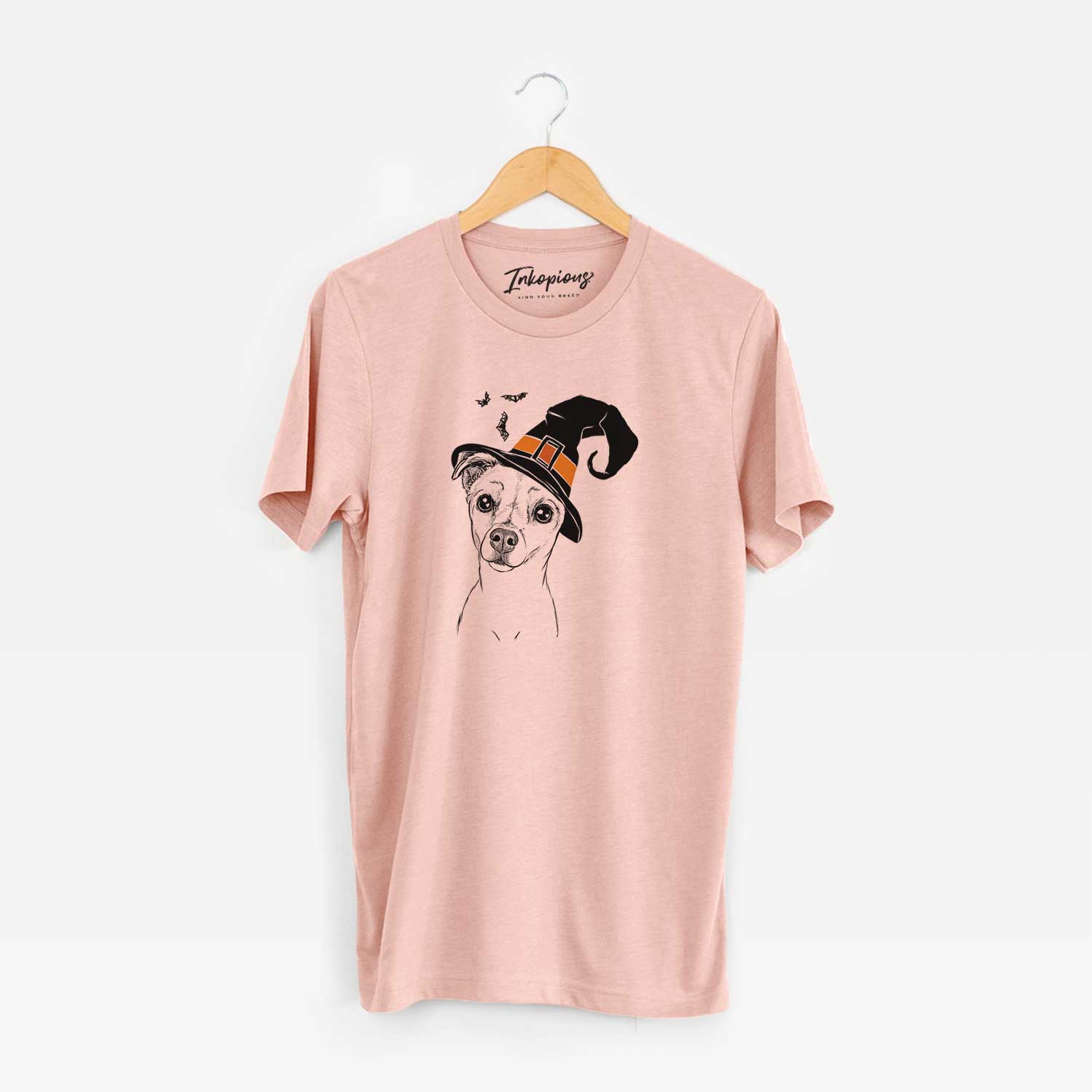 Hand-drawn sketch of Izzy the Chiweenie wearing a witch hat on a Peach Unisex crewneck