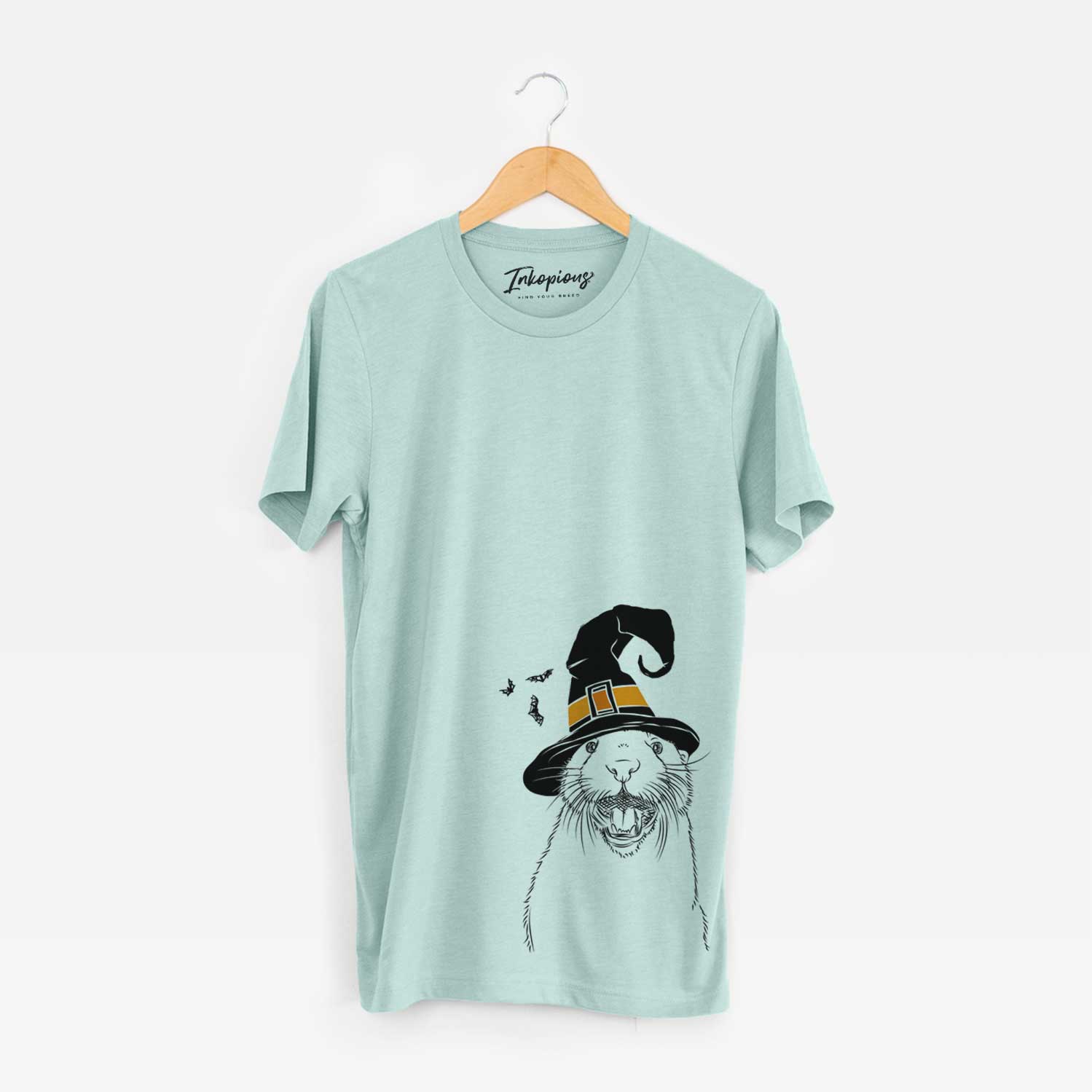 Hand-drawn sketch of Jasper the River Otter wearing a witch hat on a Heather Sage Unisex crewneck