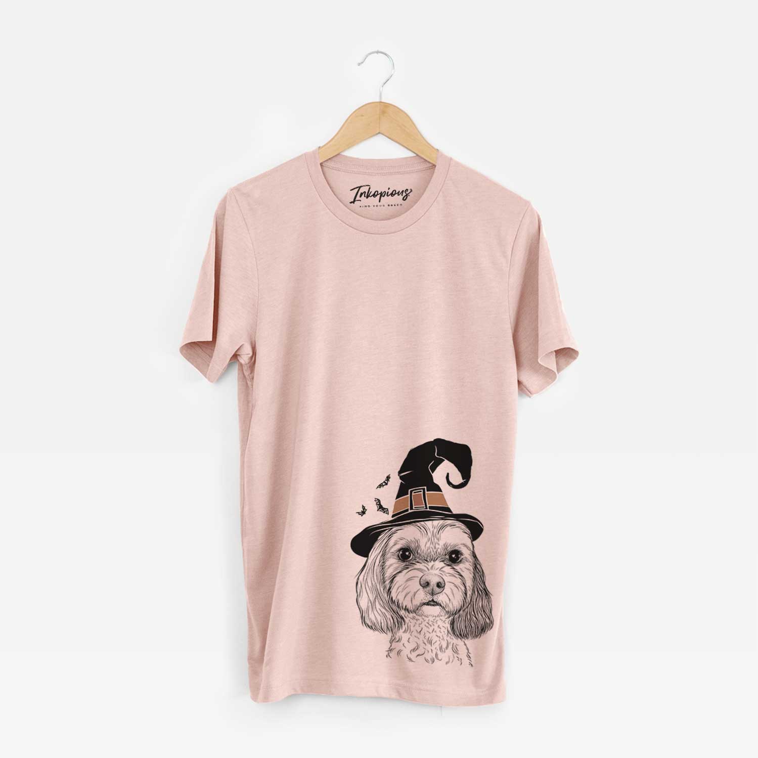 Hand-drawn sketch of Jasper Diggins the Cavapoo wearing a witch hat on a Peach Unisex crewneck