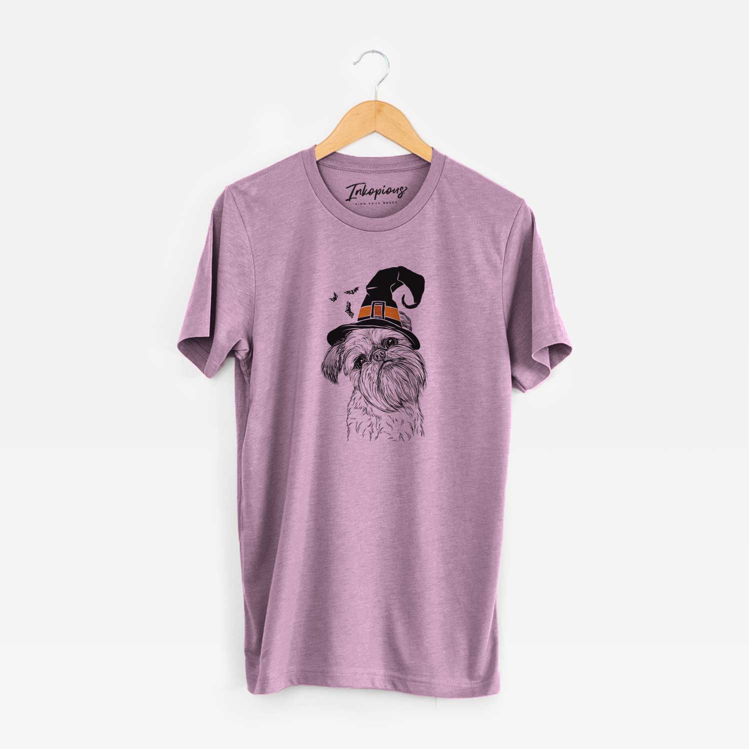 Hand-drawn sketch of Jasper Joe the Brussels Griffon wearing a witch hat on an Orchid Unisex crewneck