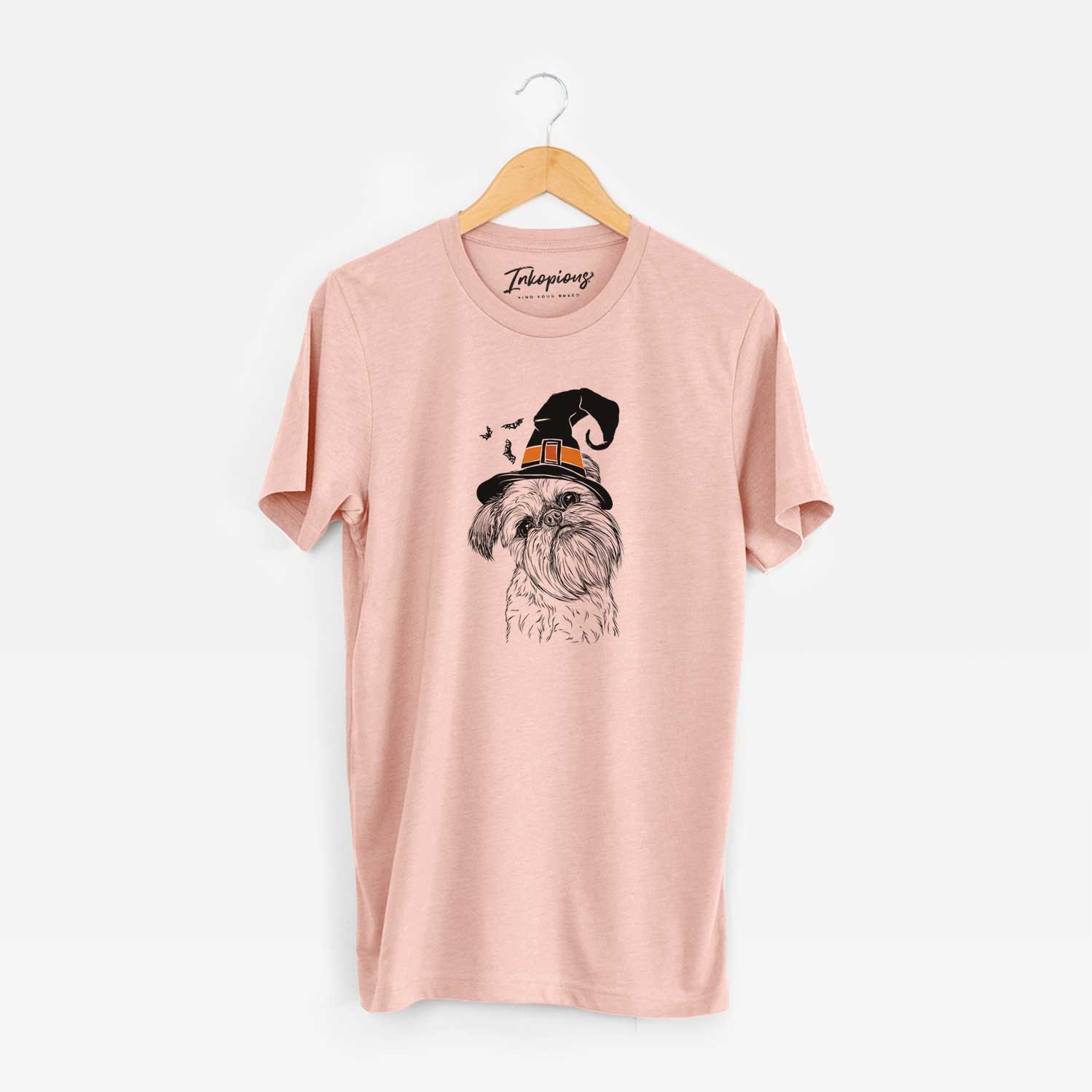 Hand-drawn sketch of Jasper Joe the Brussels Griffon wearing a witch hat on a Peach Unisex crewneck