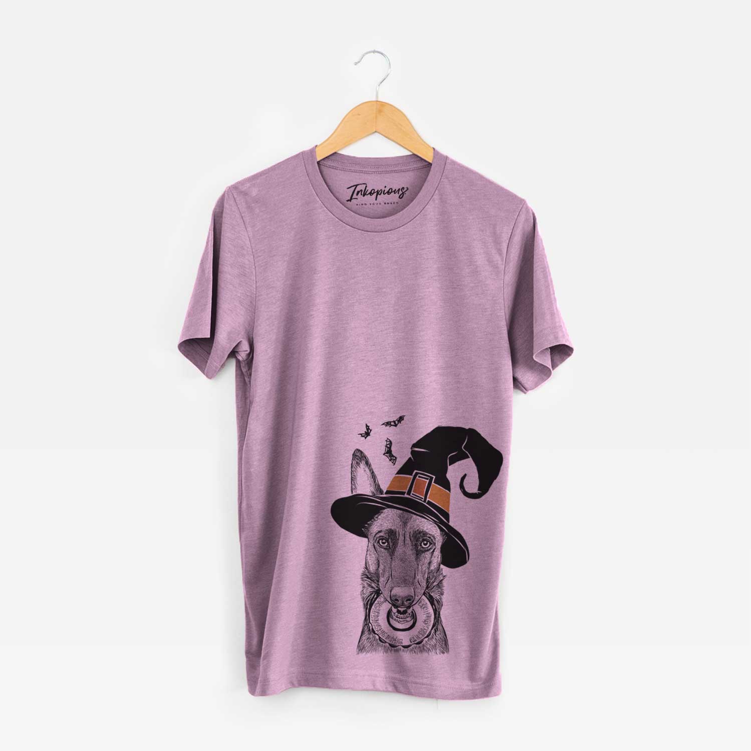 Hand-drawn sketch of Juno the Belgian Malinois wearing a witch hat on an Orchid Unisex crewneck
