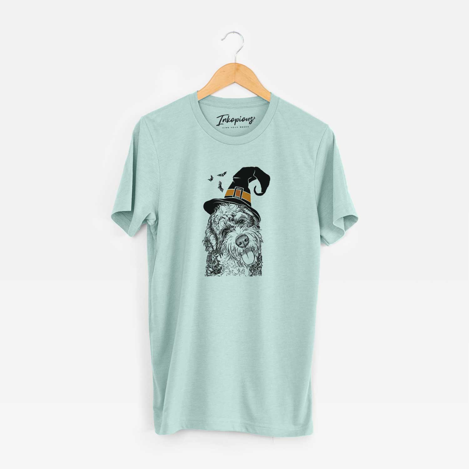 Hand-drawn sketch of Kaci the Bernedoodle wearing a witch hat on a Heather Sage Unisex crewneck