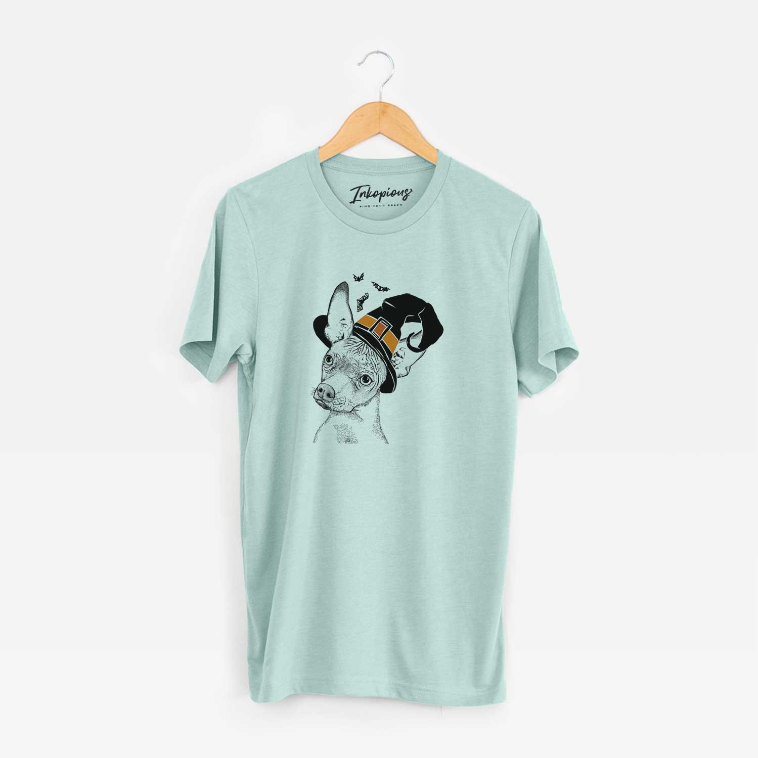 Hand-drawn sketch of Kahlo the Xoloitzcuintli wearing a witch hat on a Heather Sage Unisex crewneck