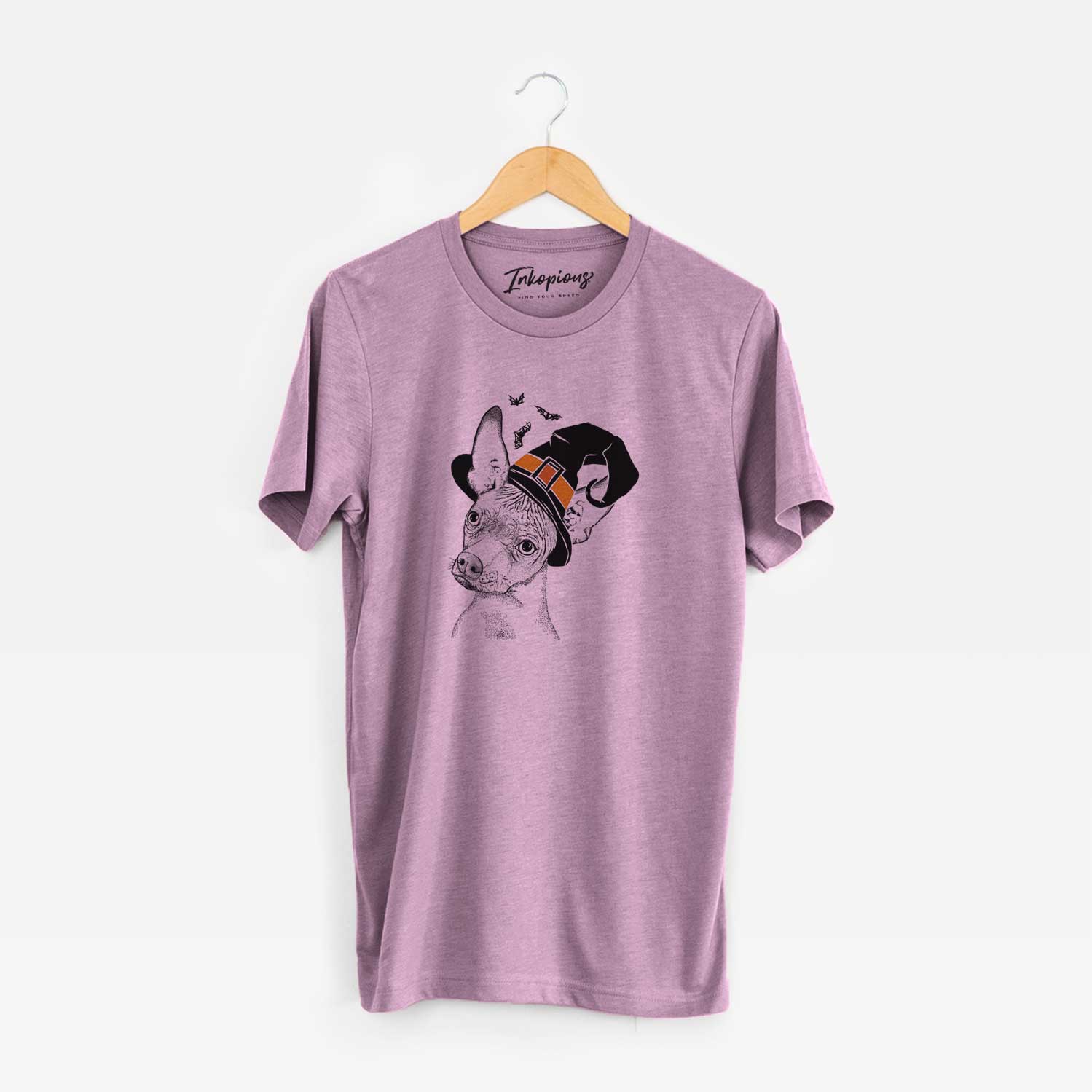 Hand-drawn sketch of Kahlo the Xoloitzcuintli wearing a witch hat on an Orchid Unisex crewneck