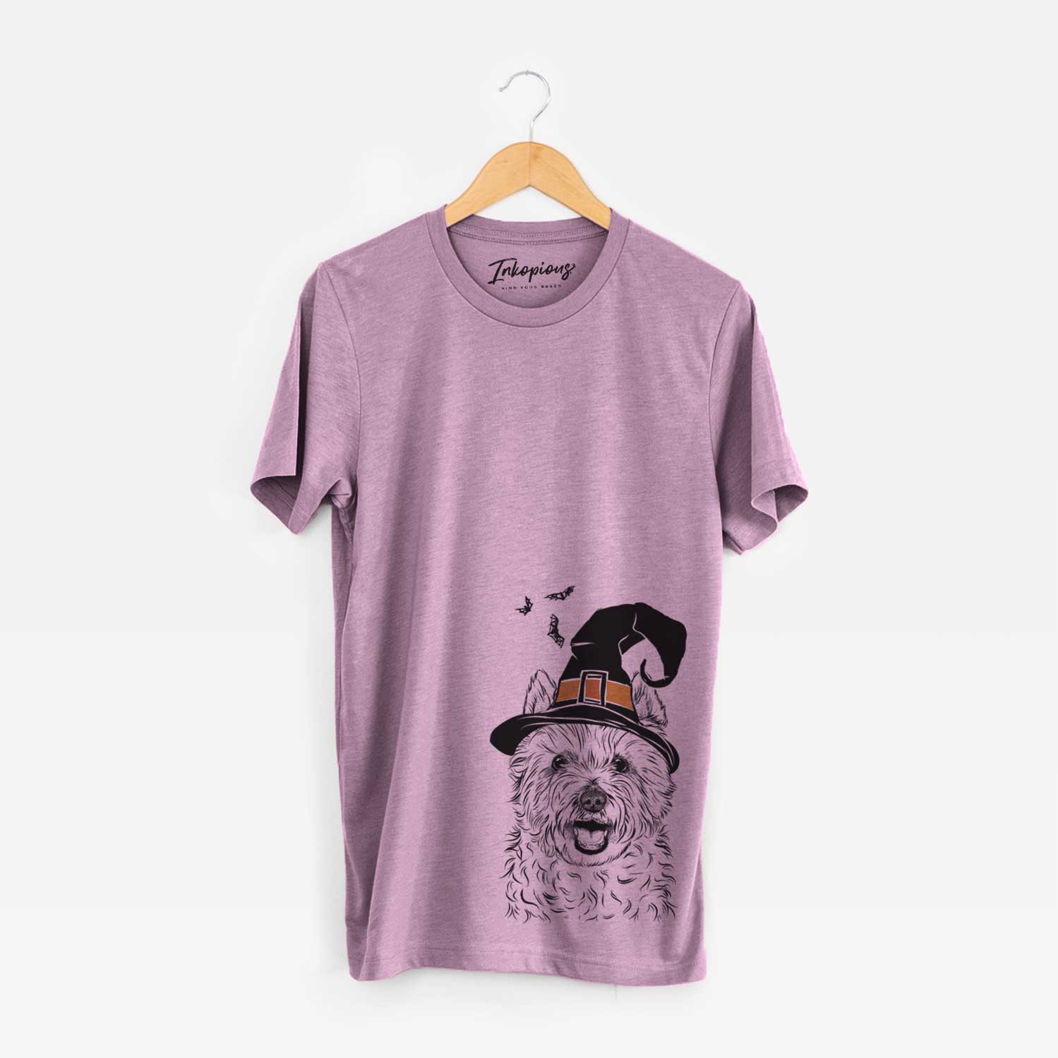 Hand-drawn sketch of Kami the West Highland Terrier wearing a witch hat on an Orchid Unisex crewneck