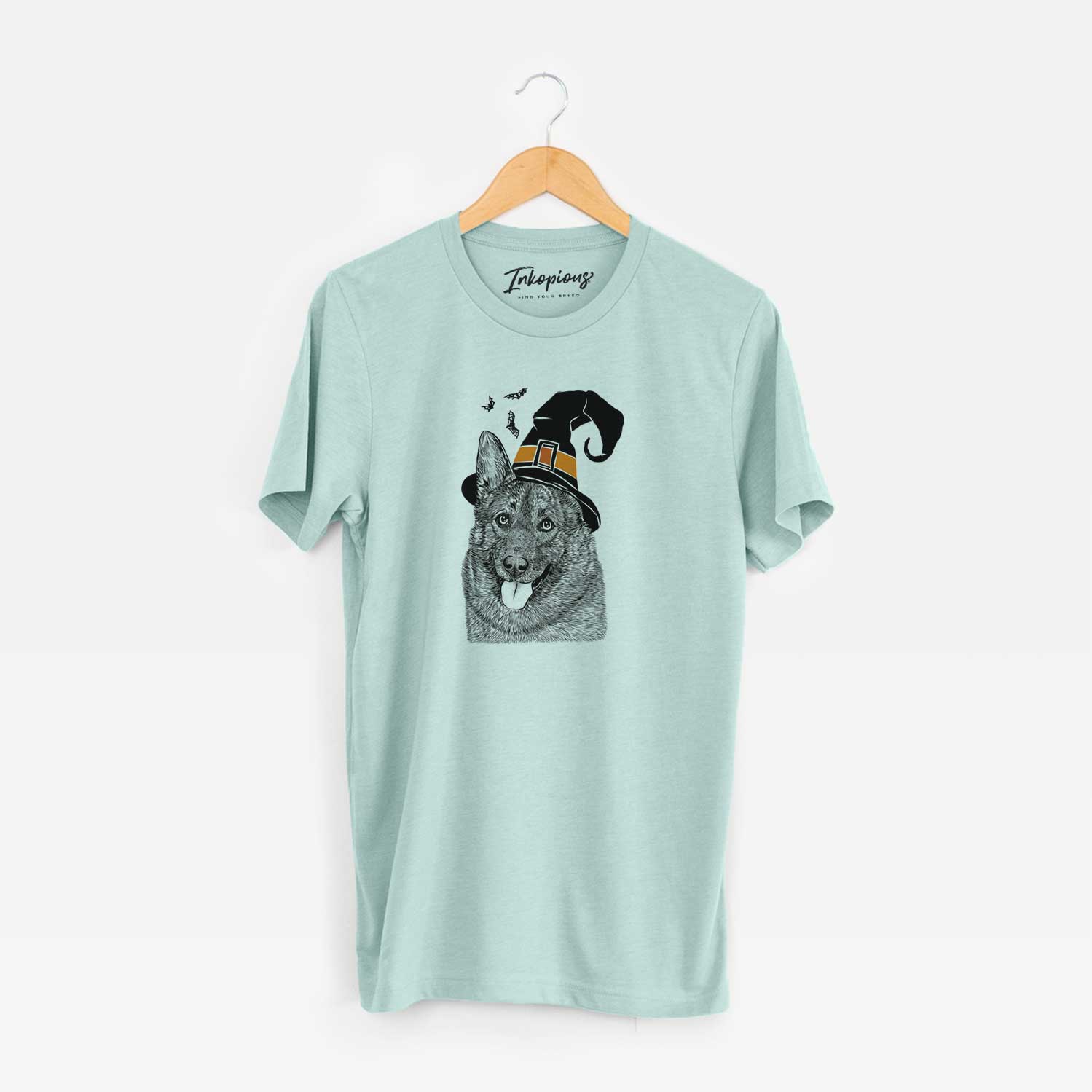 Hand-drawn sketch of Kasia the Norwegian Elkhound wearing a witch hat on a Heather Sage Unisex crewneck
