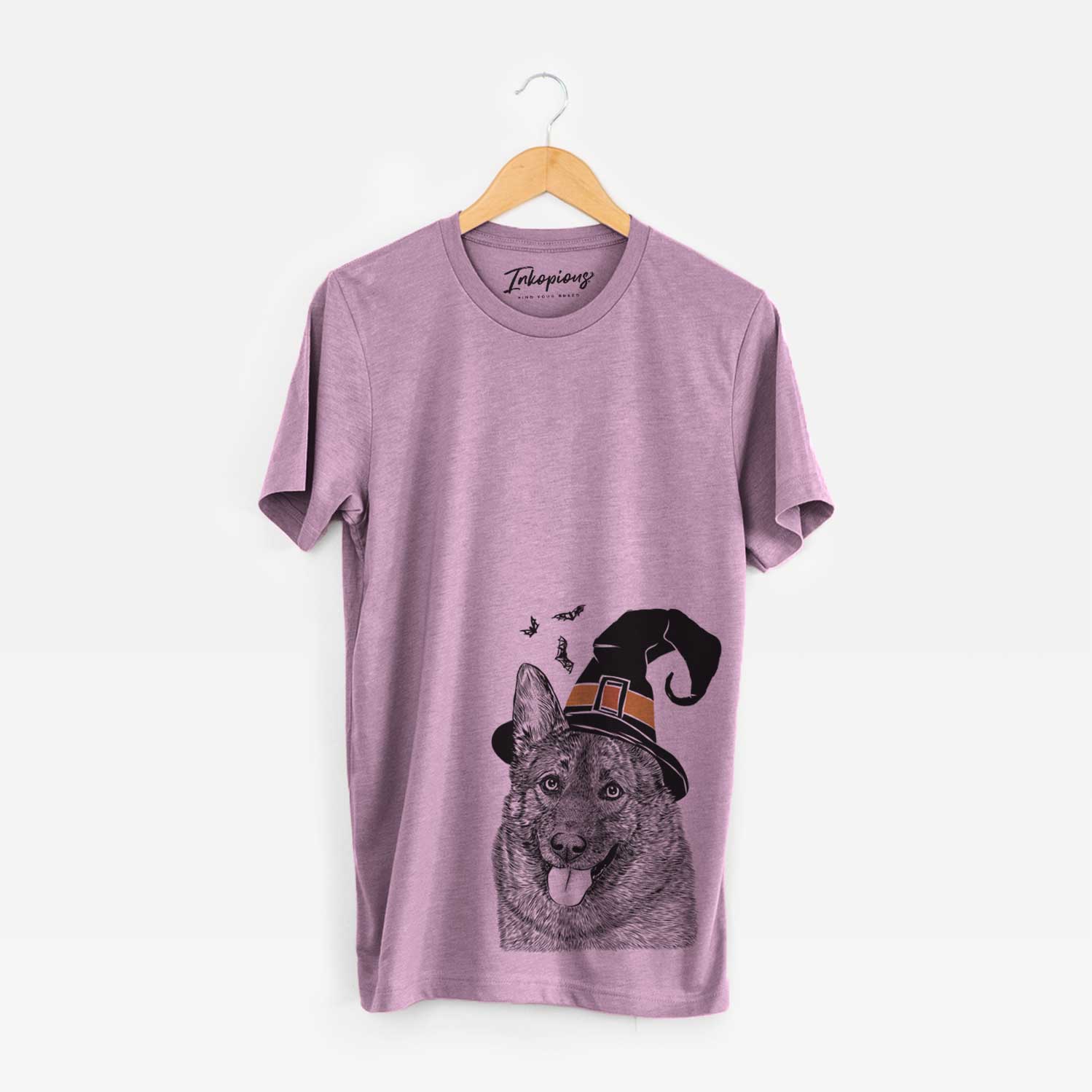 Hand-drawn sketch of Kasia the Norwegian Elkhound wearing a witch hat on an Orchid Unisex crewneck