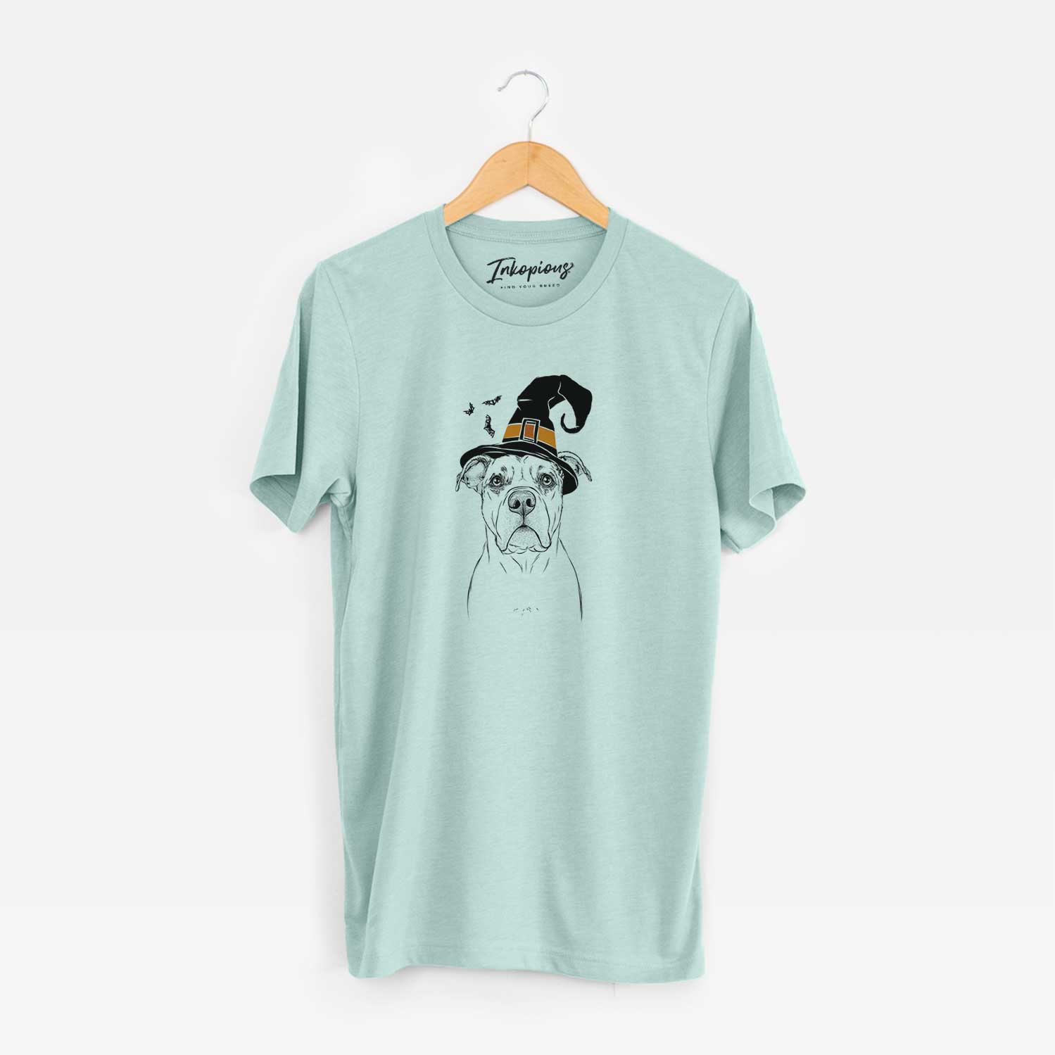 Hand-drawn sketch of KiaOra the Pitbull Mix wearing a witch hat on a Heather Sage Unisex crewneck