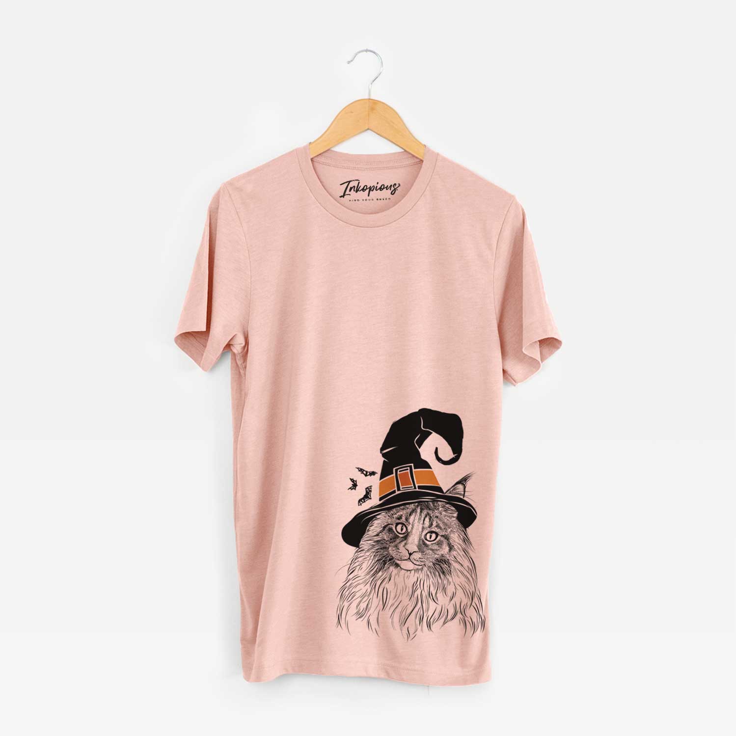 Hand-drawn sketch of Kiki the Maine Coon Cat wearing a witch hat on a Peach Unisex crewneck
