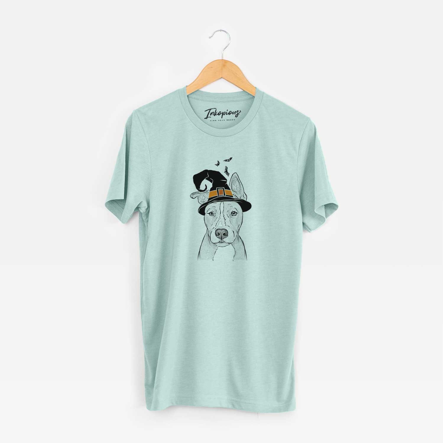 Hand-drawn sketch of Kisses the Pitbull wearing a witch hat on a Heather Sage Unisex crewneck