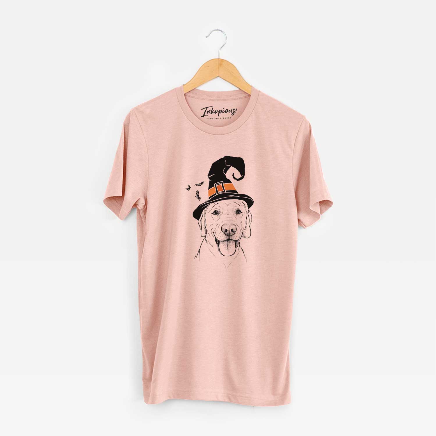Hand-drawn sketch of Klay the Labrador Retriever wearing a witch hat on a Peach Unisex crewneck