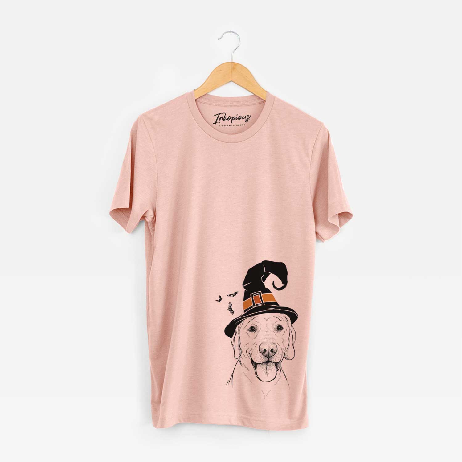 Hand-drawn sketch of Klay the Labrador Retriever wearing a witch hat on a Peach Unisex crewneck