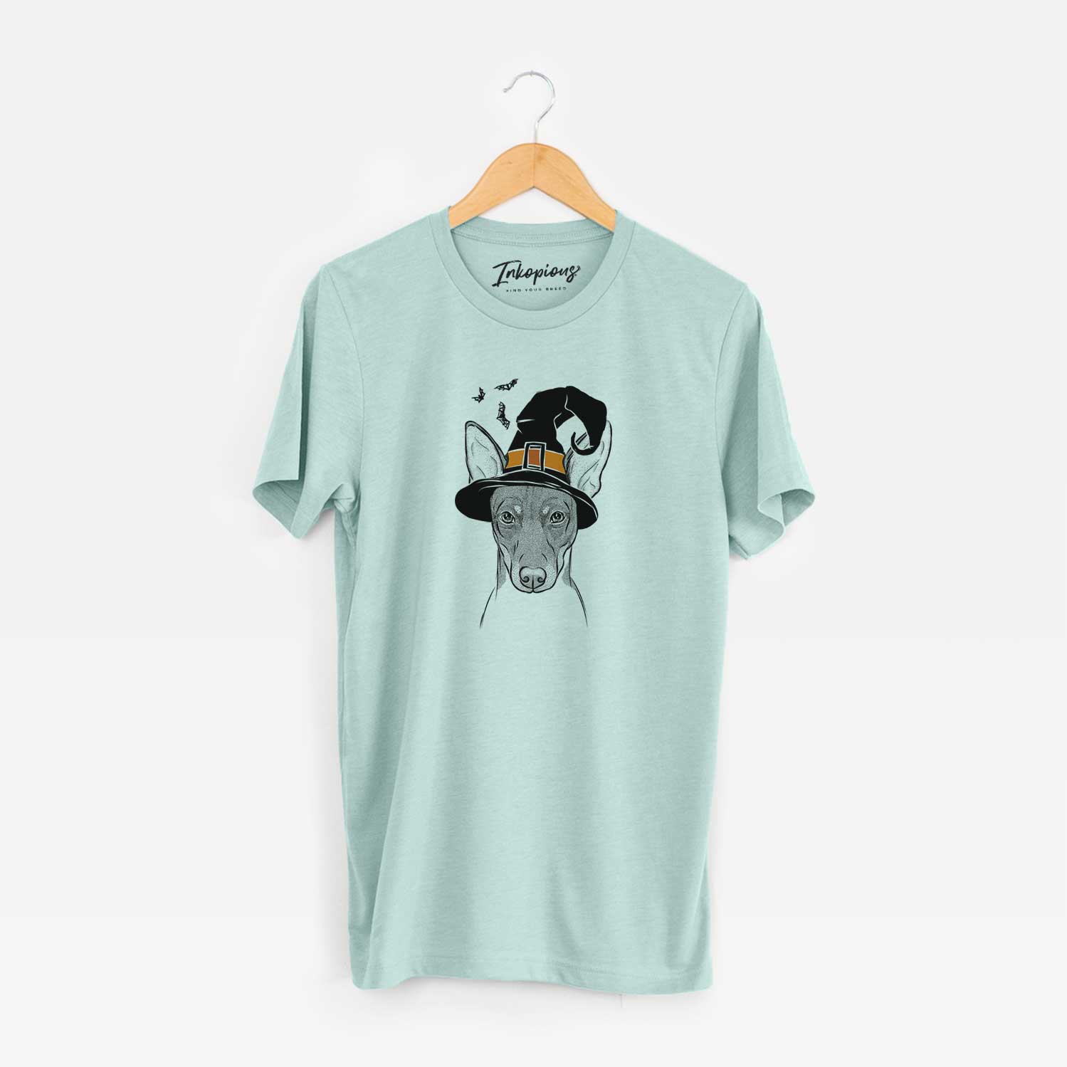 Hand-drawn sketch of Knox the Rat Terrier wearing a witch hat on a Heather Sage Unisex crewneck