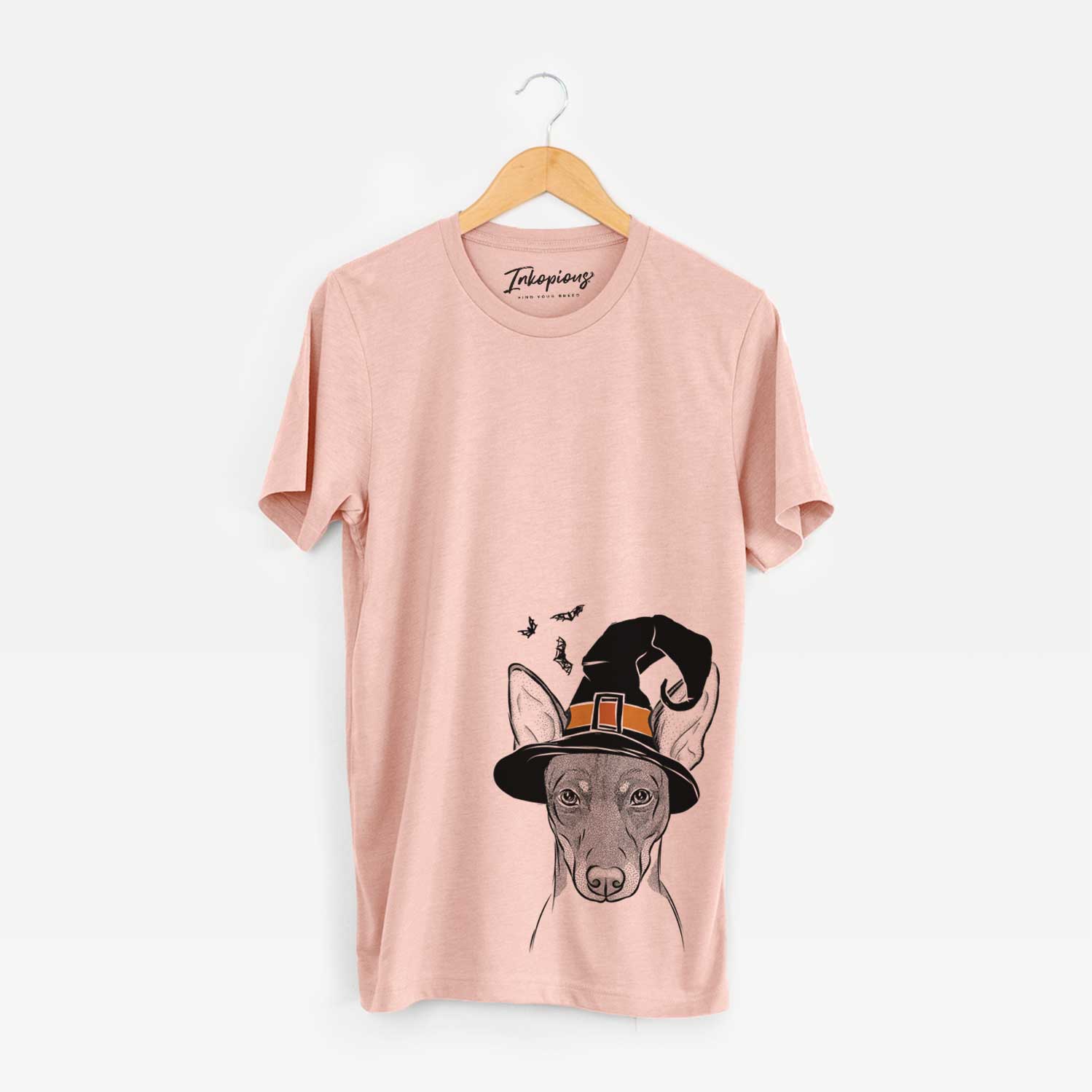 Hand-drawn sketch of Knox the Rat Terrier wearing a witch hat on a Peach Unisex crewneck