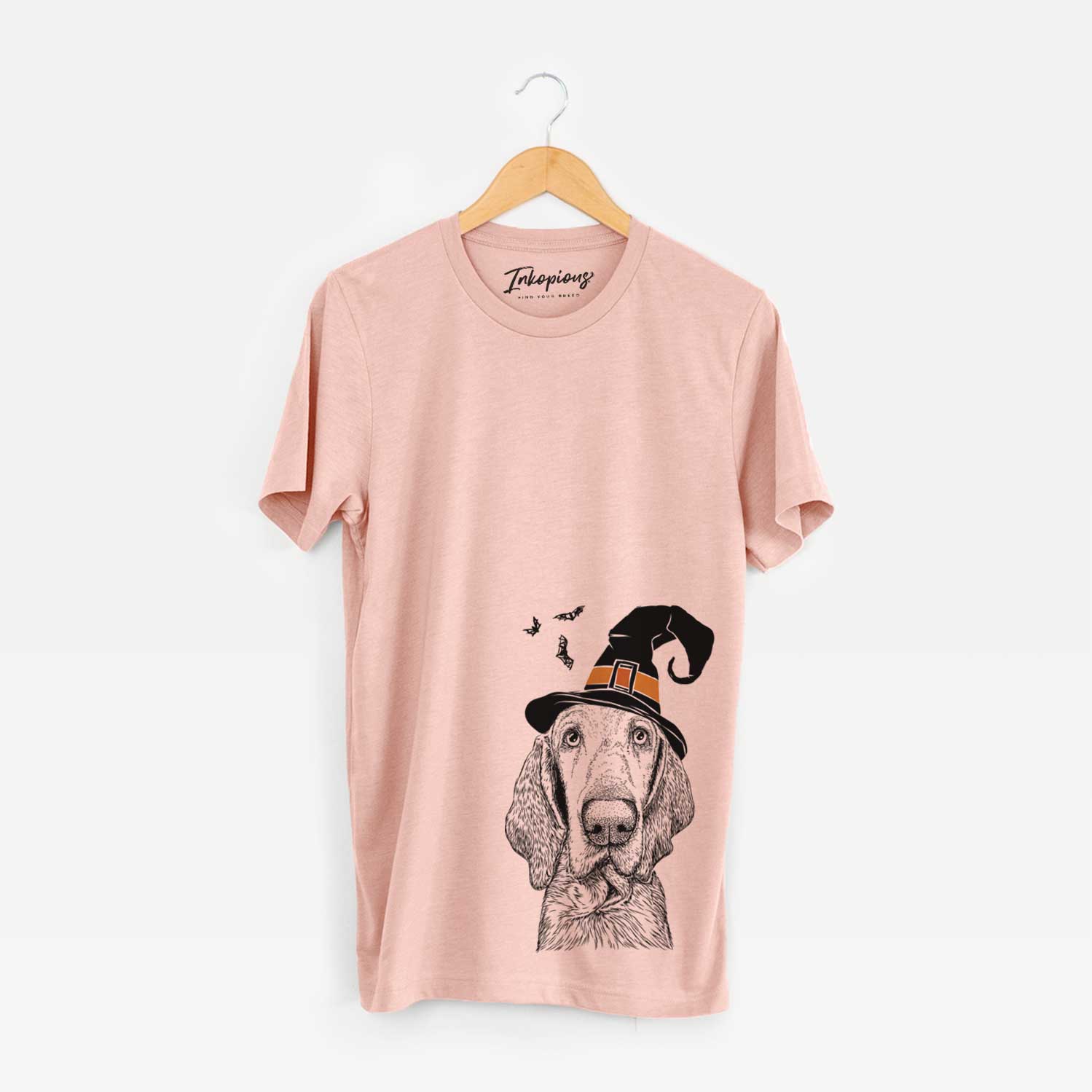 Hand-drawn sketch of Kylie the Bracco Italiano wearing a witch hat on a Peach Unisex crewneck