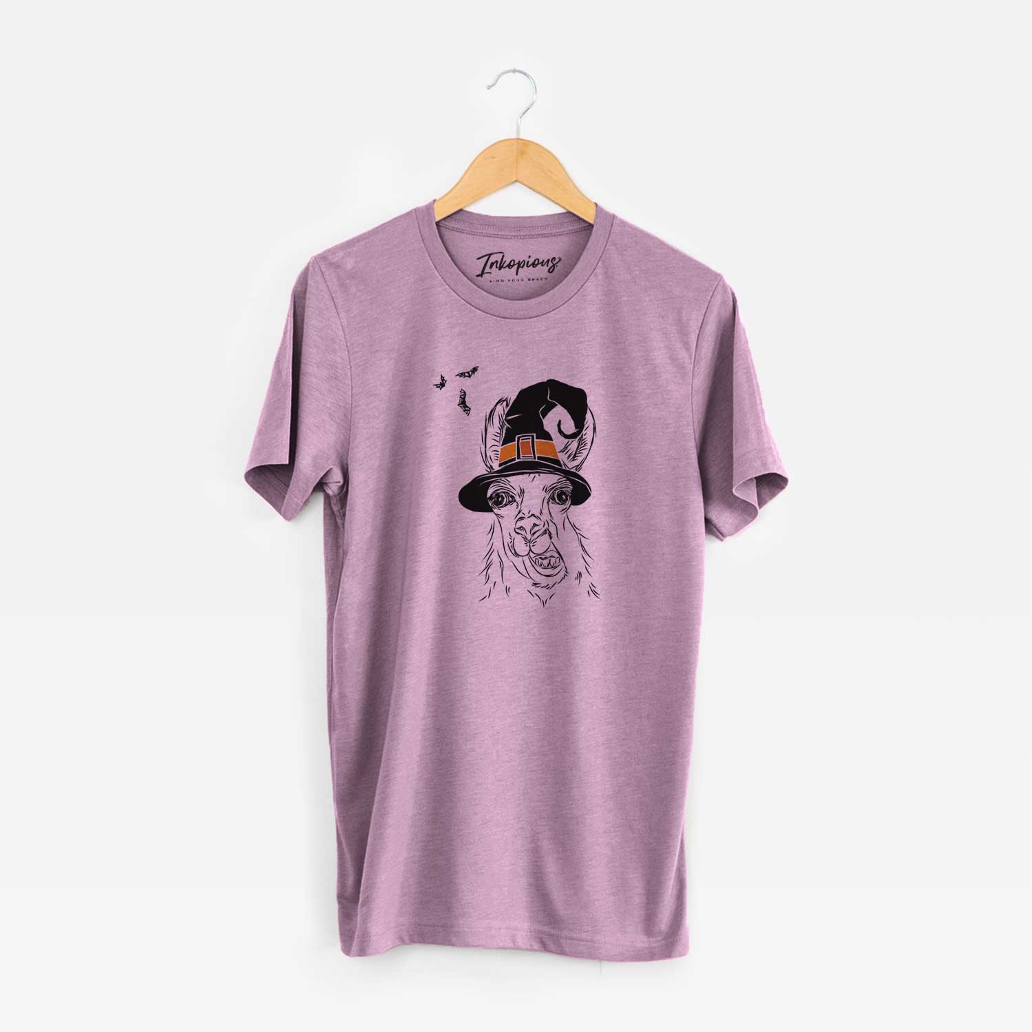 Hand-drawn sketch of Larry the Llama wearing a witch hat on an Orchid Unisex crewneck