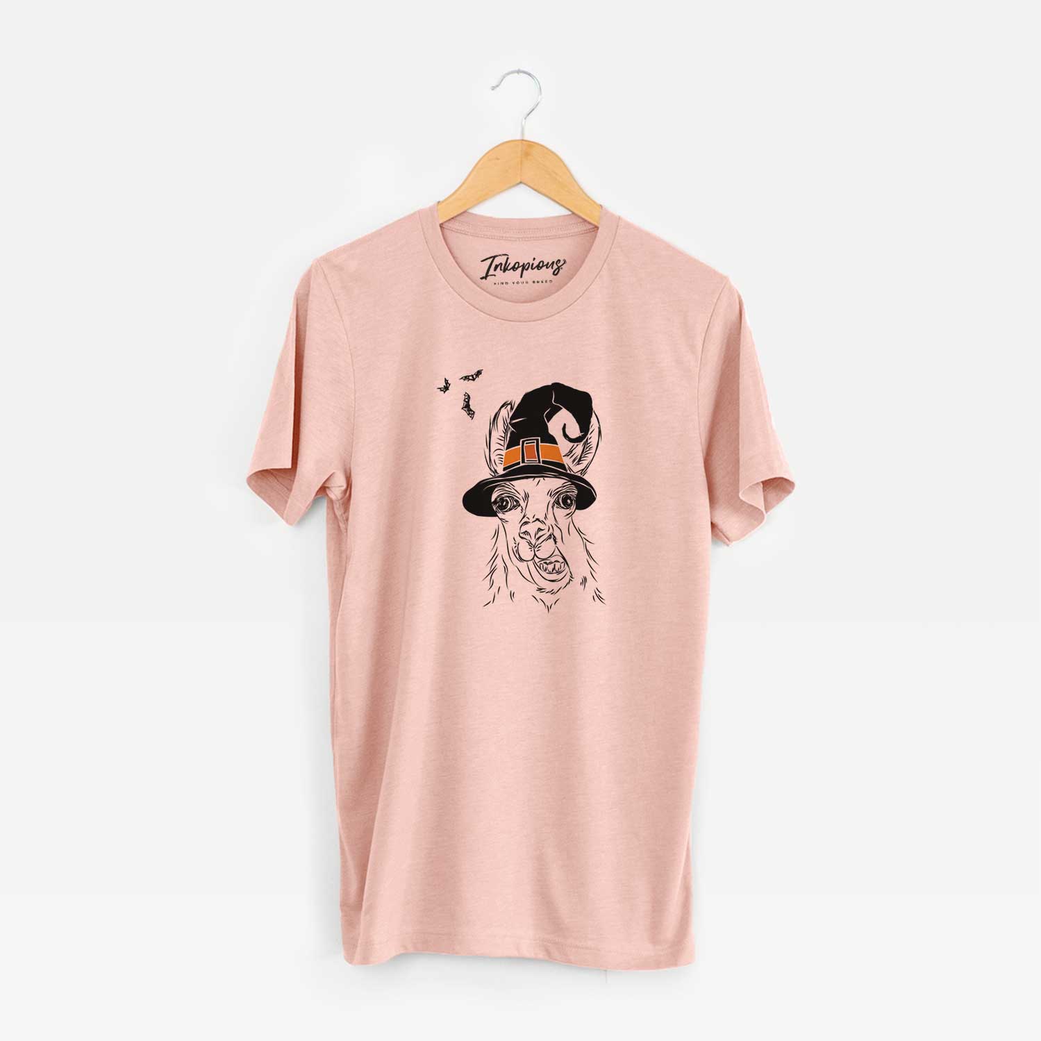 Hand-drawn sketch of Larry the Llama wearing a witch hat on a Peach Unisex crewneck