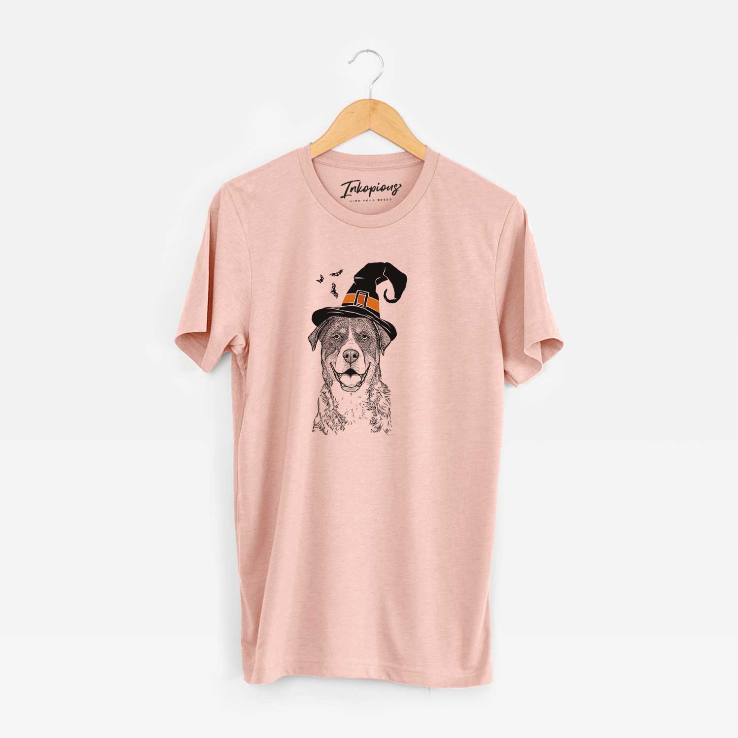 Hand-drawn sketch of Leon the Greater Swiss Mountain Dog wearing a witch hat on a Peach Unisex crewneck