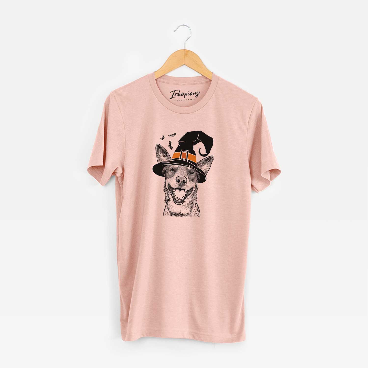 Hand-drawn sketch of Lily the Australian Cattle Dog wearing a witch hat on a Peach Unisex crewneck