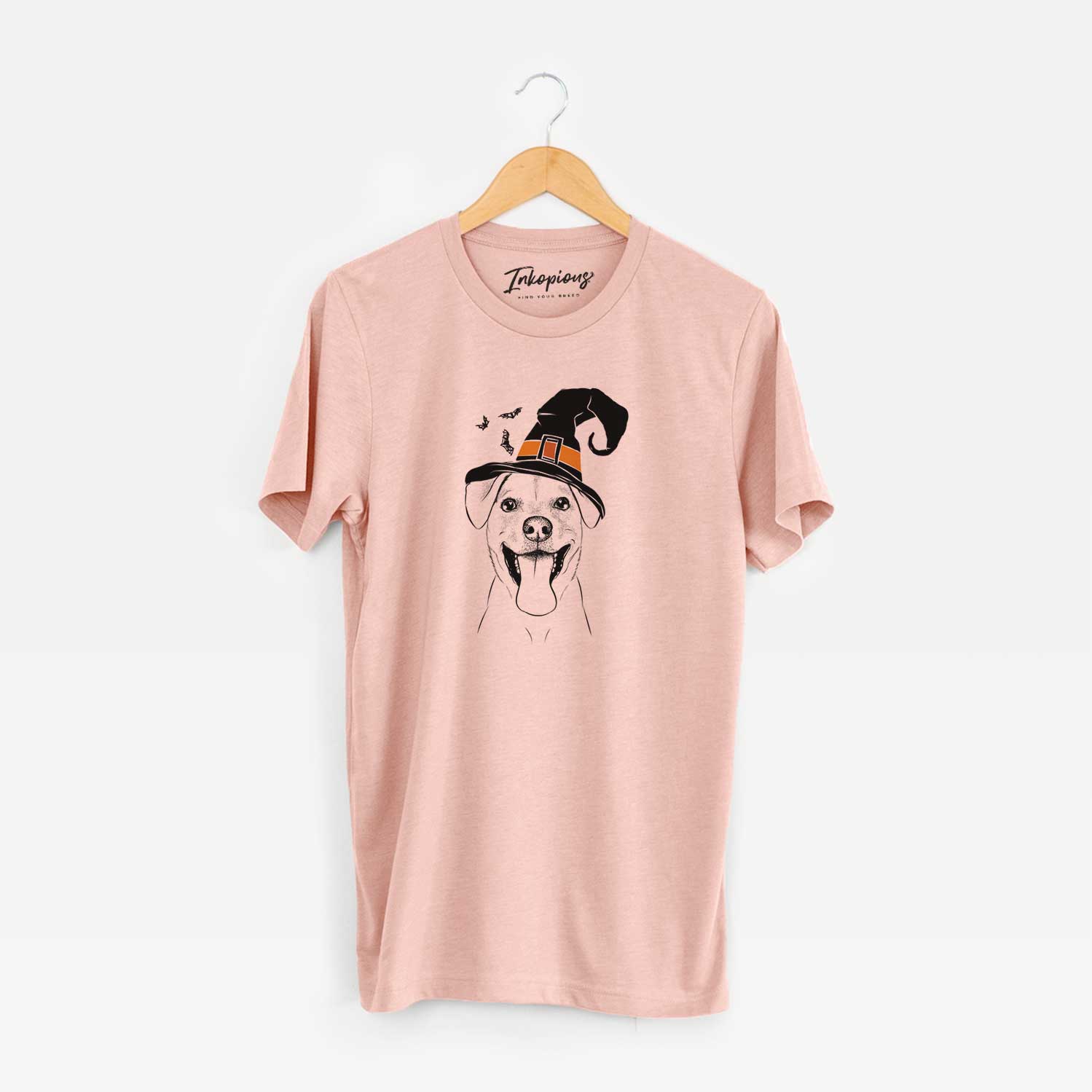 Hand-drawn sketch of Lily Estelle the Mixed Breed wearing a witch hat on a Peach Unisex crewneck