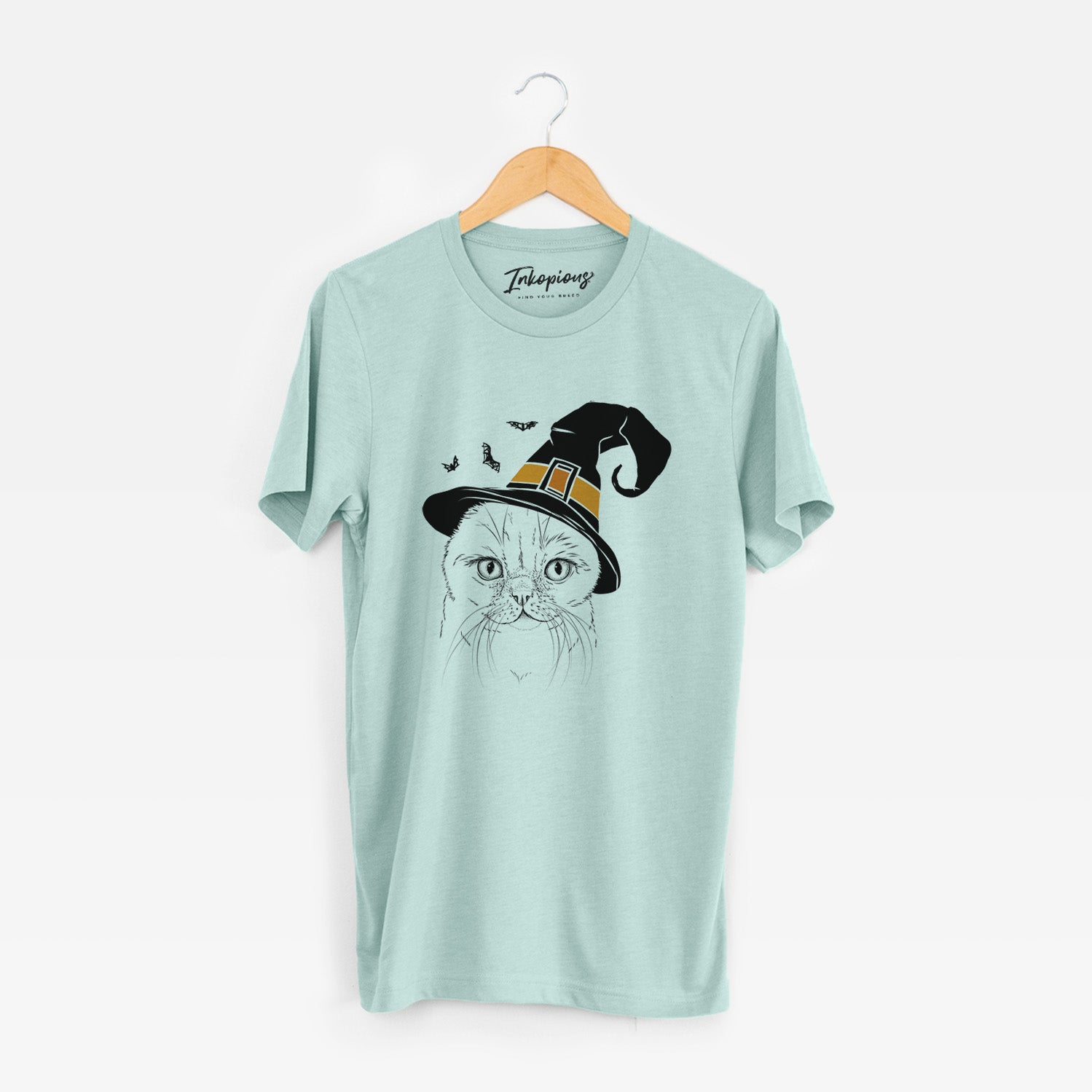 Hand-drawn sketch of Lina the Exotic Fold Cat wearing a witch hat on a Heather Sage Unisex crewneck