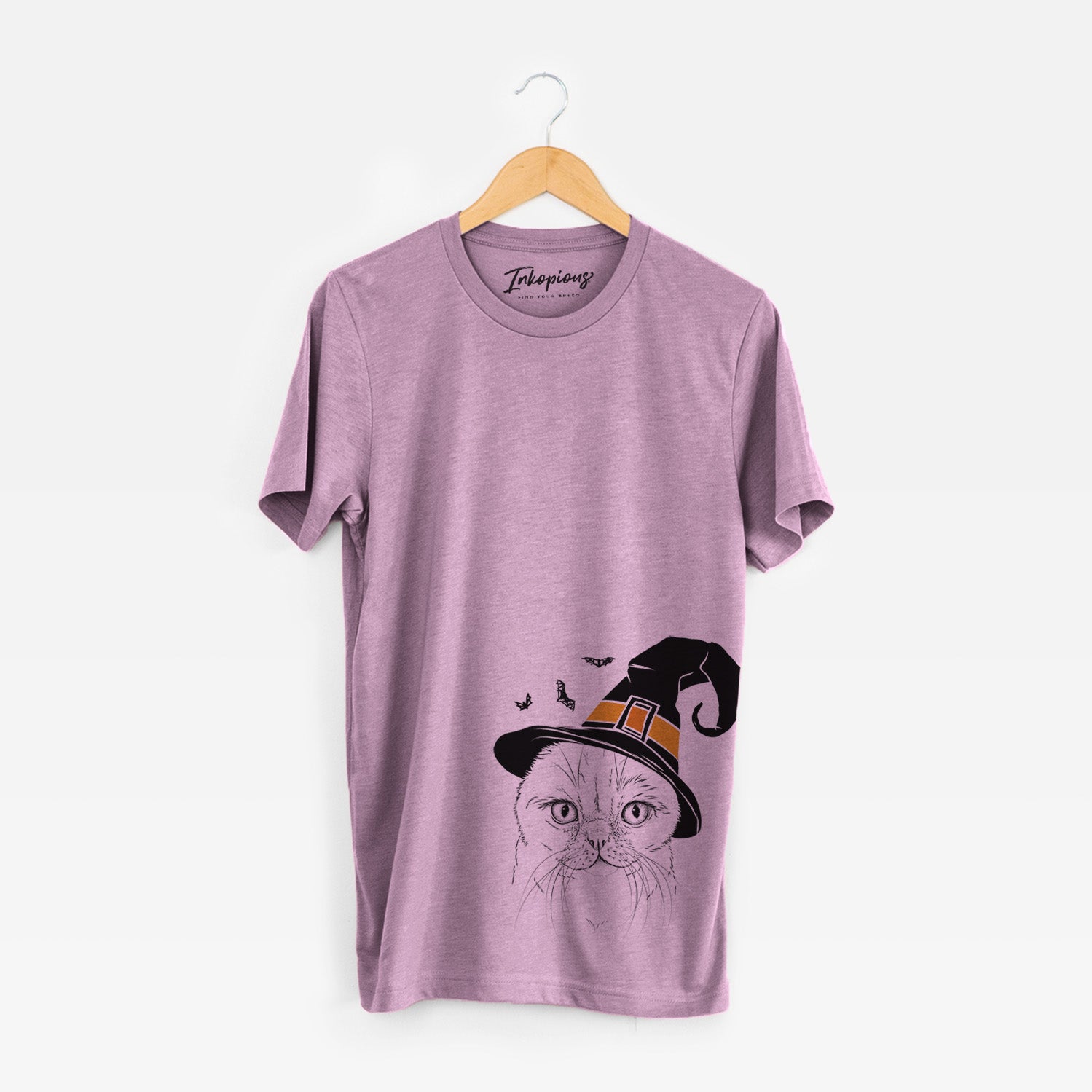 Hand-drawn sketch of Lina the Exotic Fold Cat wearing a witch hat on an Orchid Unisex crewneck