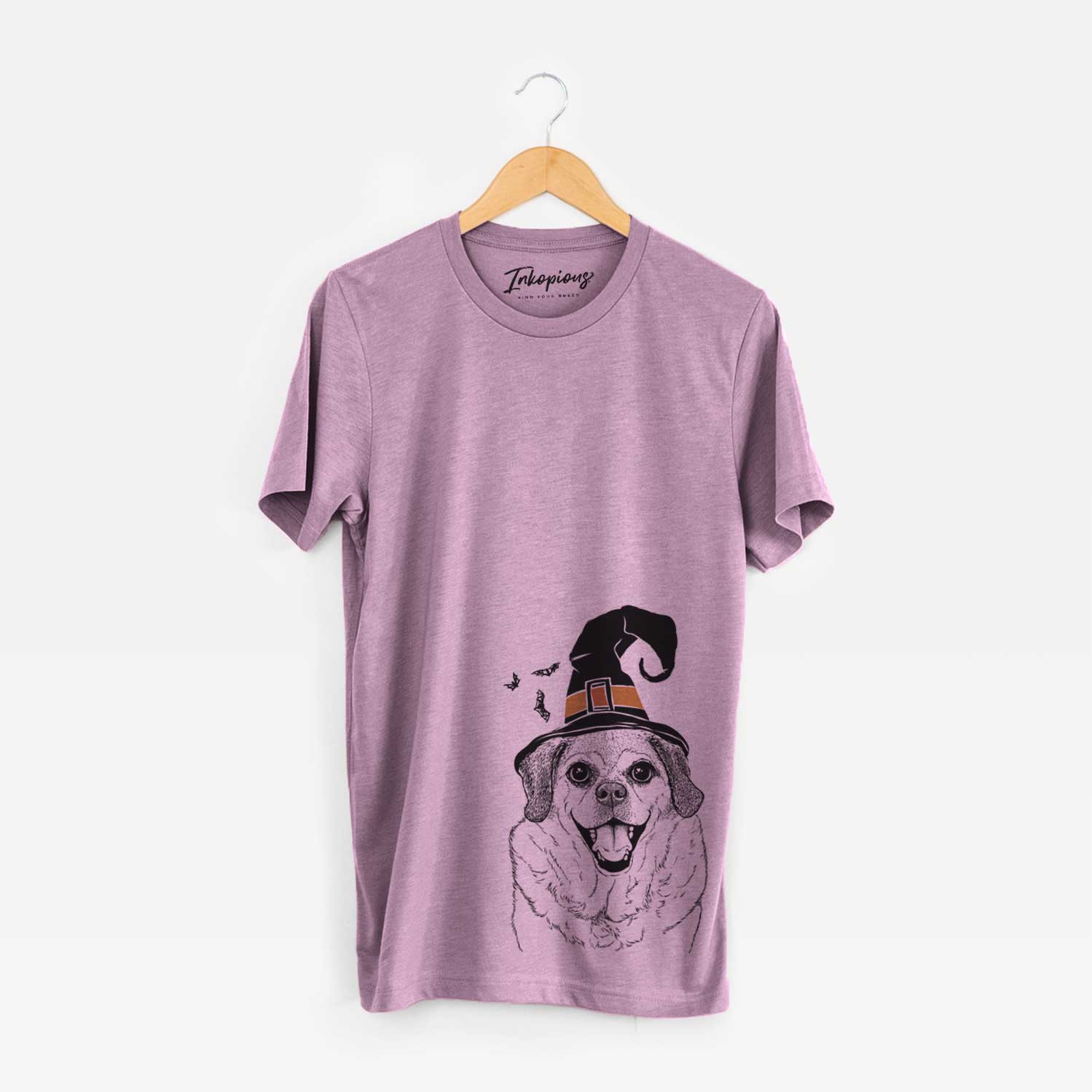 Hand-drawn sketch of Little Man the Puggle wearing a witch hat on an Orchid Unisex crewneck