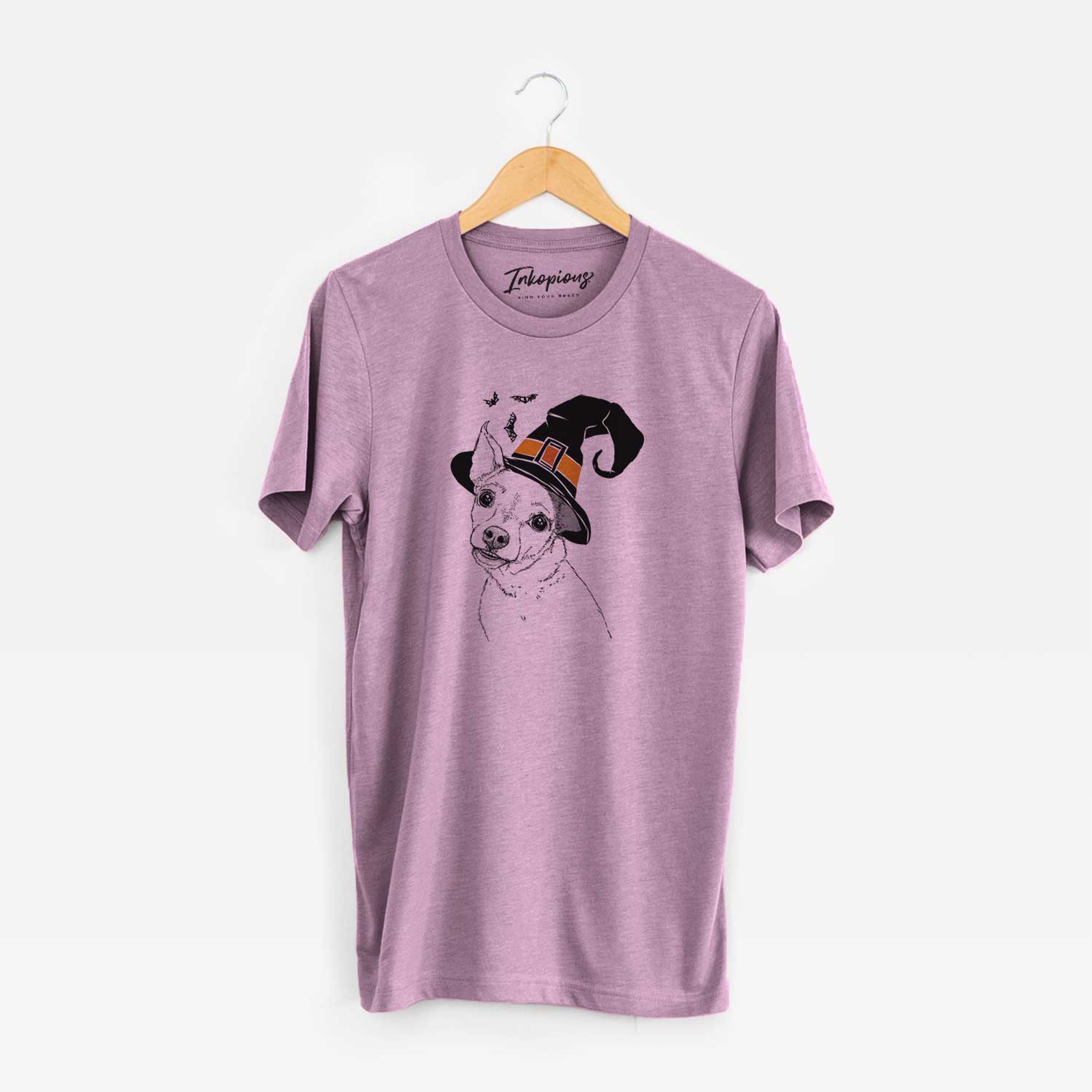 Hand-drawn sketch of Lola the Chiweenie wearing a witch hat on an Orchid Unisex crewneck