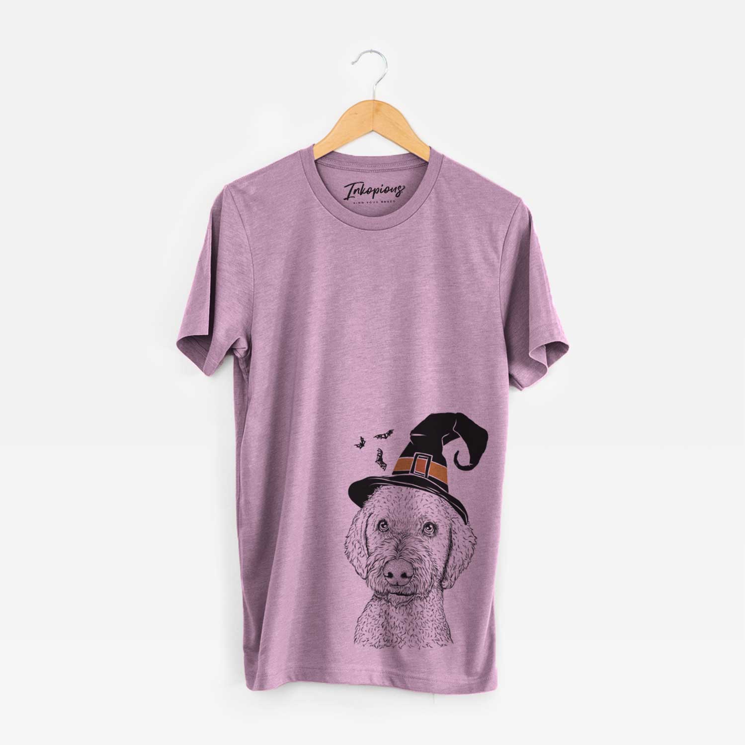 Hand-drawn sketch of Lucy Boo the Goldendoodle wearing a witch hat on an Orchid Unisex crewneck