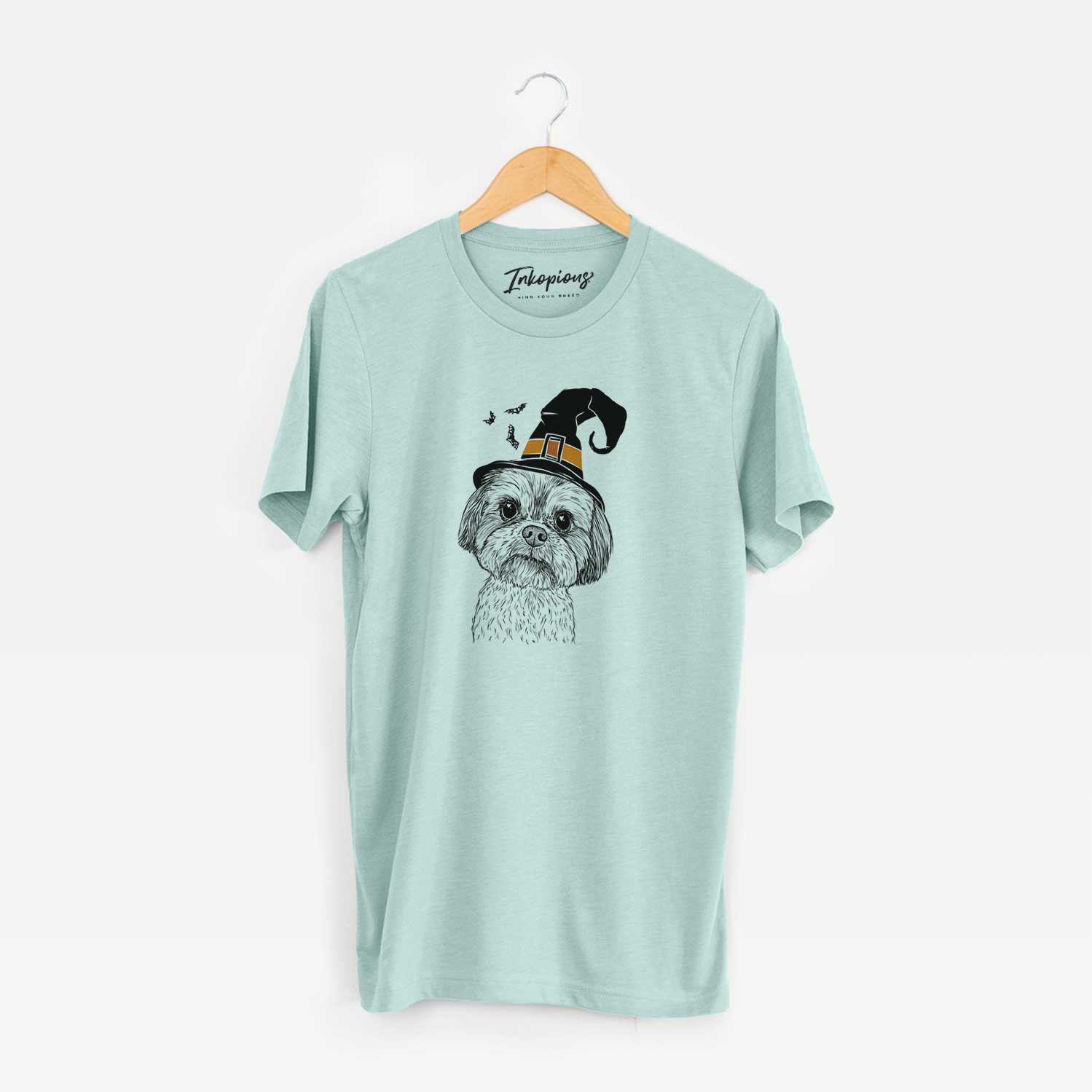Hand-drawn sketch of Lucy the Shorkie wearing a witch hat on a Heather Sage Unisex crewneck
