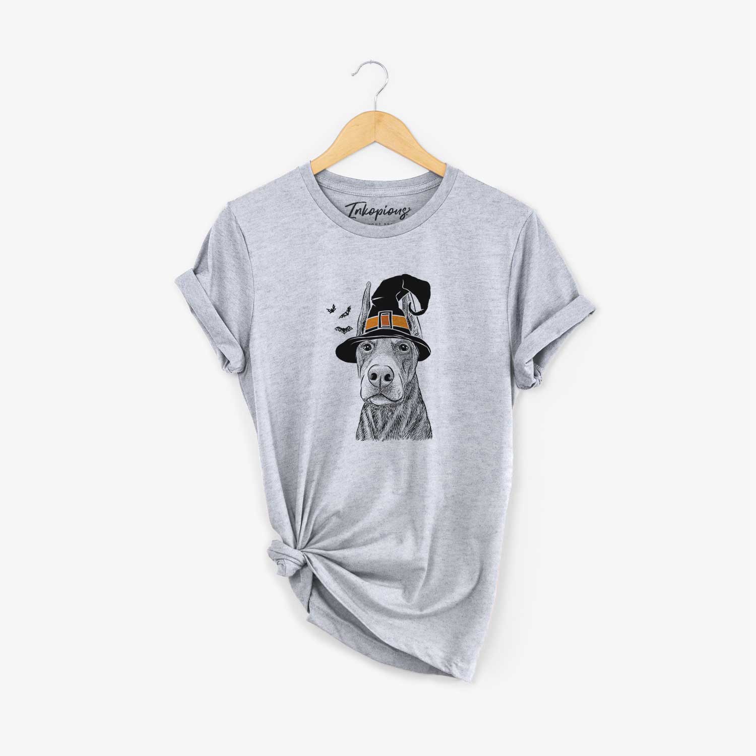 Hand-drawn sketch of Luna the Doberman Pinscher wearing a witch hat on a Grey Unisex crewneck