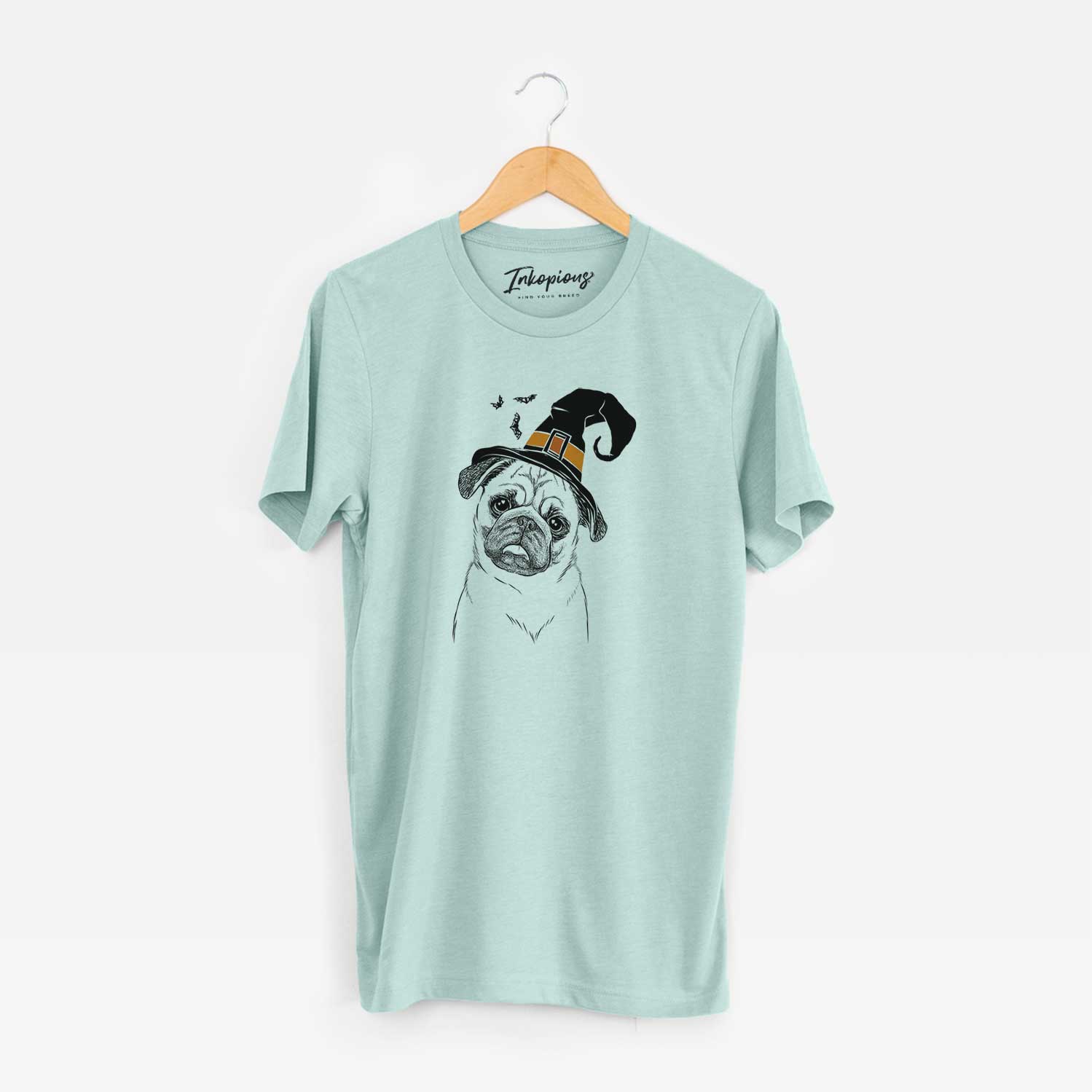 Hand-drawn sketch of Macy the Pug wearing a witch hat on a Heather Sage Unisex crewneck