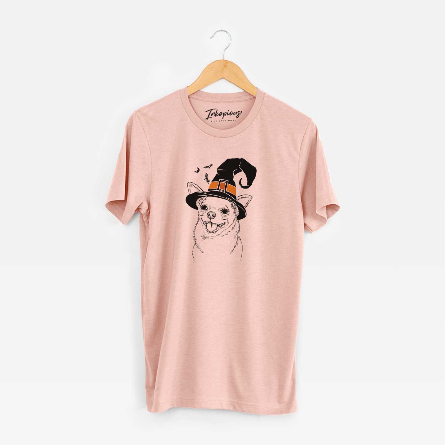 Hand-drawn sketch of Maddison Pearl the Chihuahua wearing a witch hat on a Peach Unisex crewneck