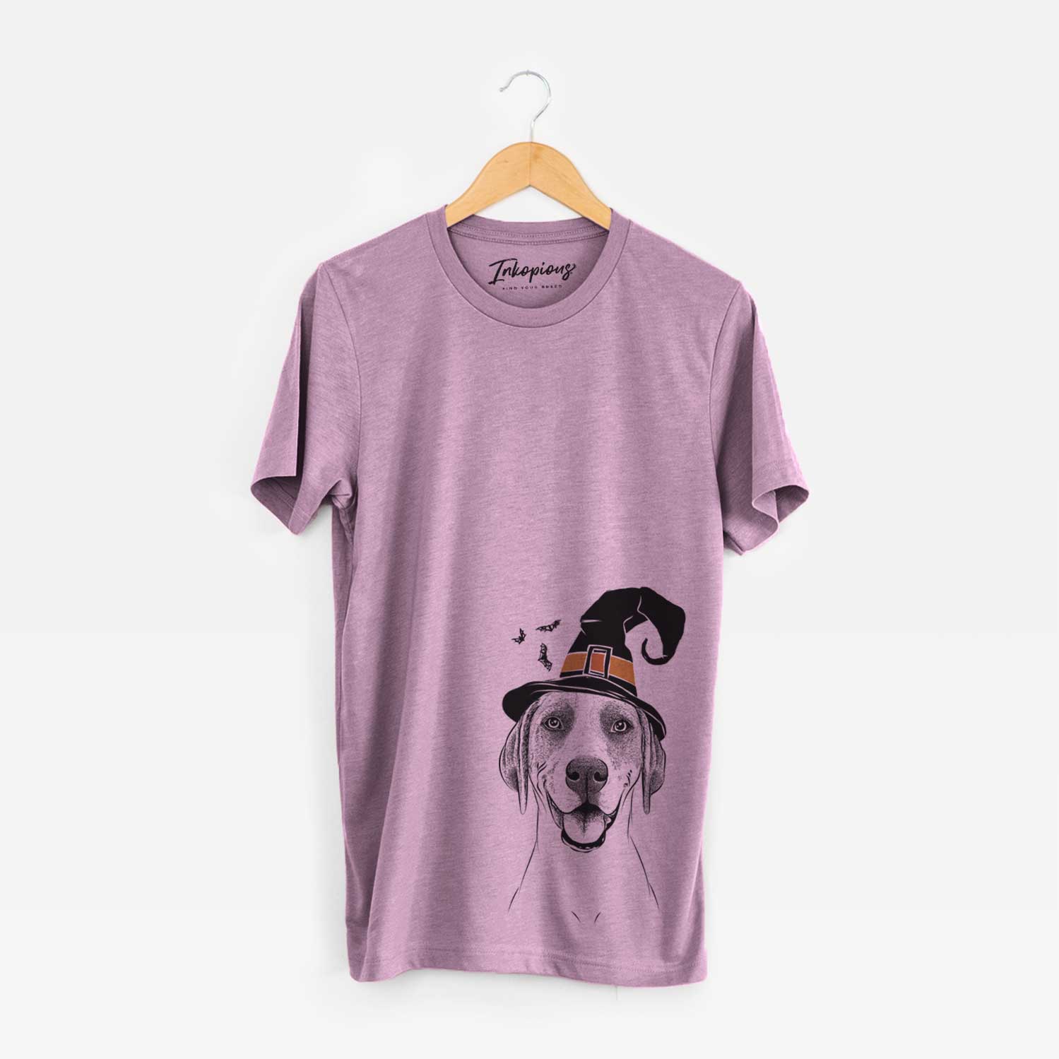 Hand-drawn sketch of Maggie the Treeing Walker Coonhound wearing a witch hat on an Orchid Unisex crewneck