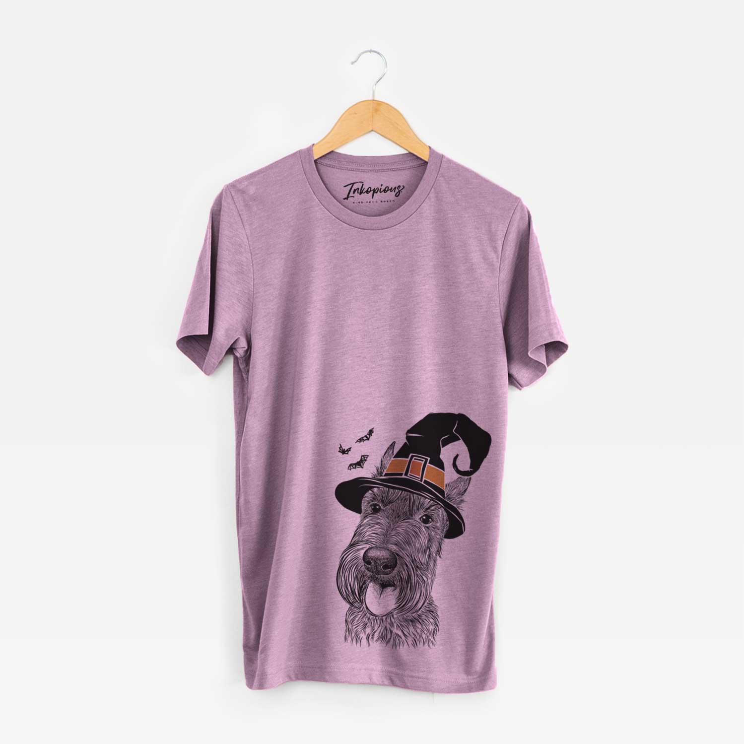 Hand-drawn sketch of Magnus the Scottish Terrier wearing a witch hat on an Orchid Unisex crewneck
