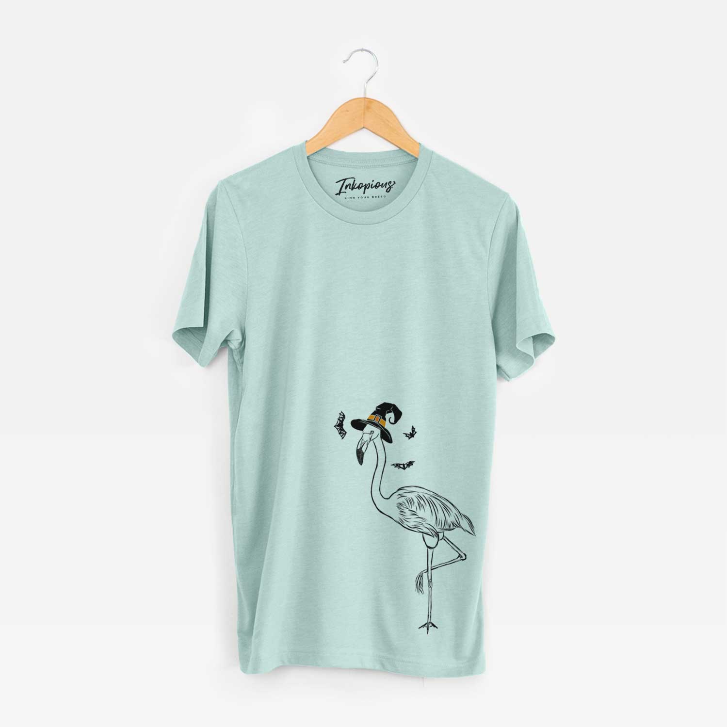 Hand-drawn sketch of Mango the Flamingo wearing a witch hat on a Heather Sage Unisex crewneck
