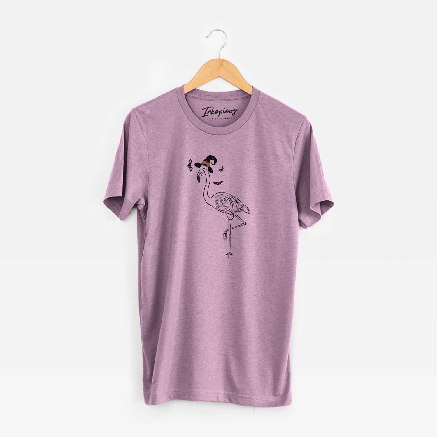 Hand-drawn sketch of Mango the Flamingo wearing a witch hat on an Orchid Unisex crewneck